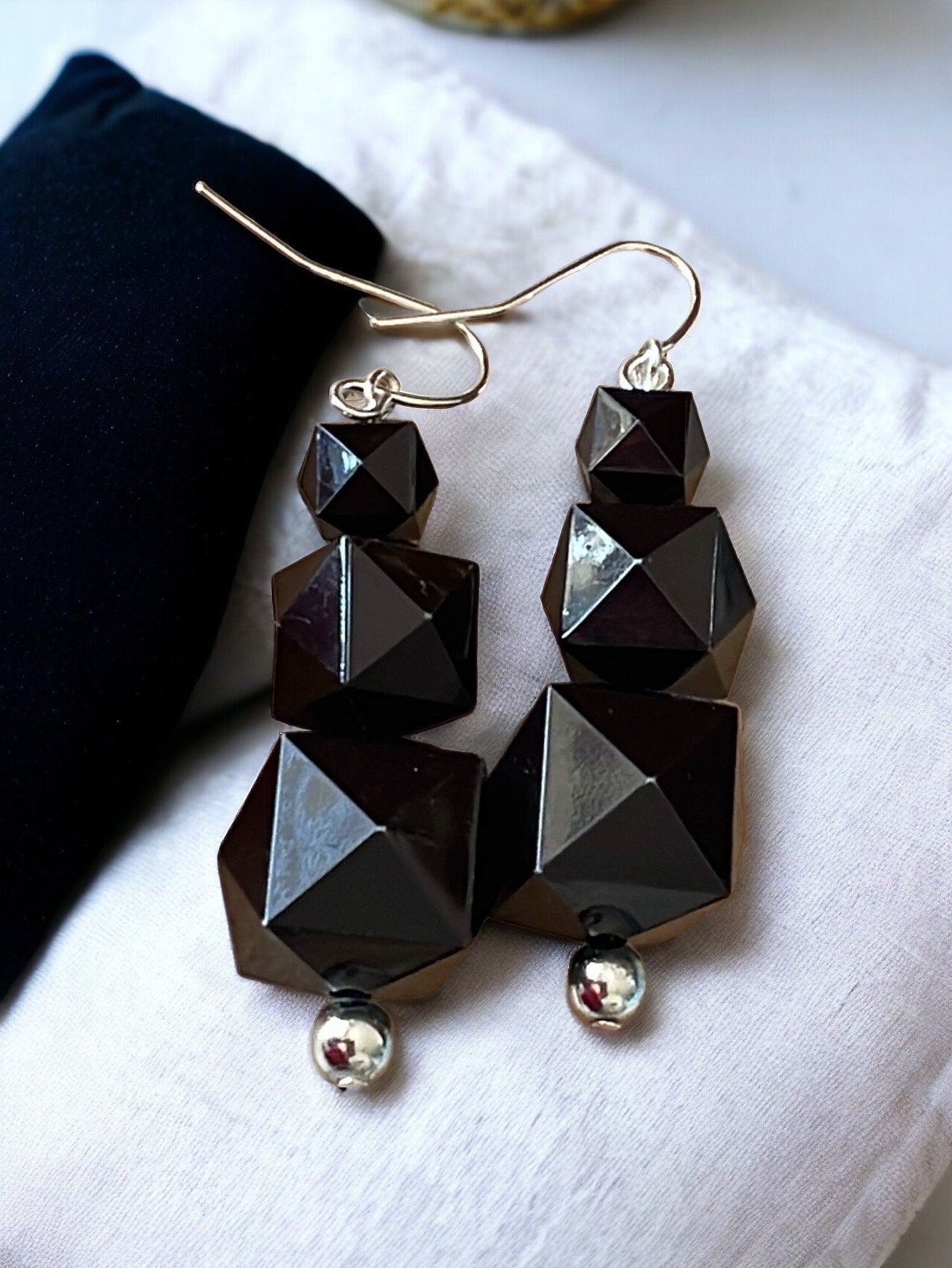 Your choice of coral or black faceted dangle earrings