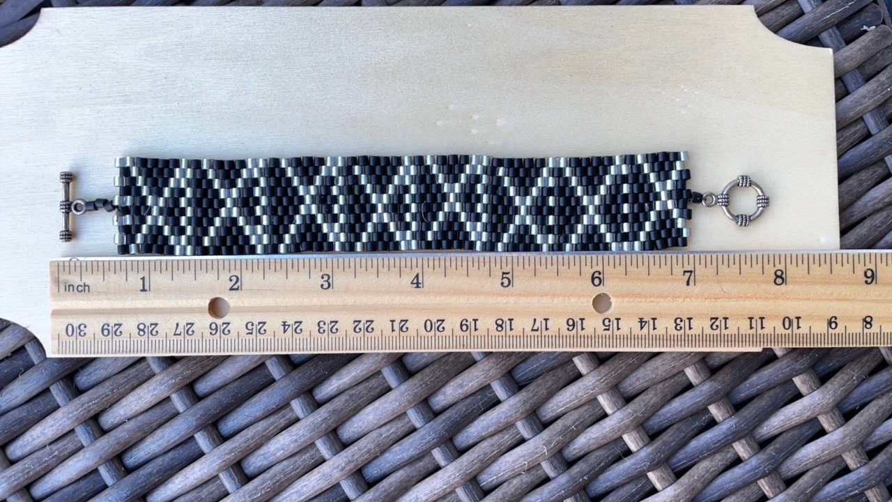 Stunning vintage silver and black hand woven vintage beadwork bracelet