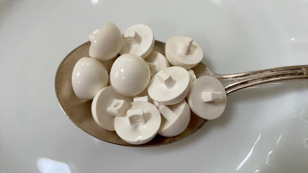 Lot of white domed top vintage buttons