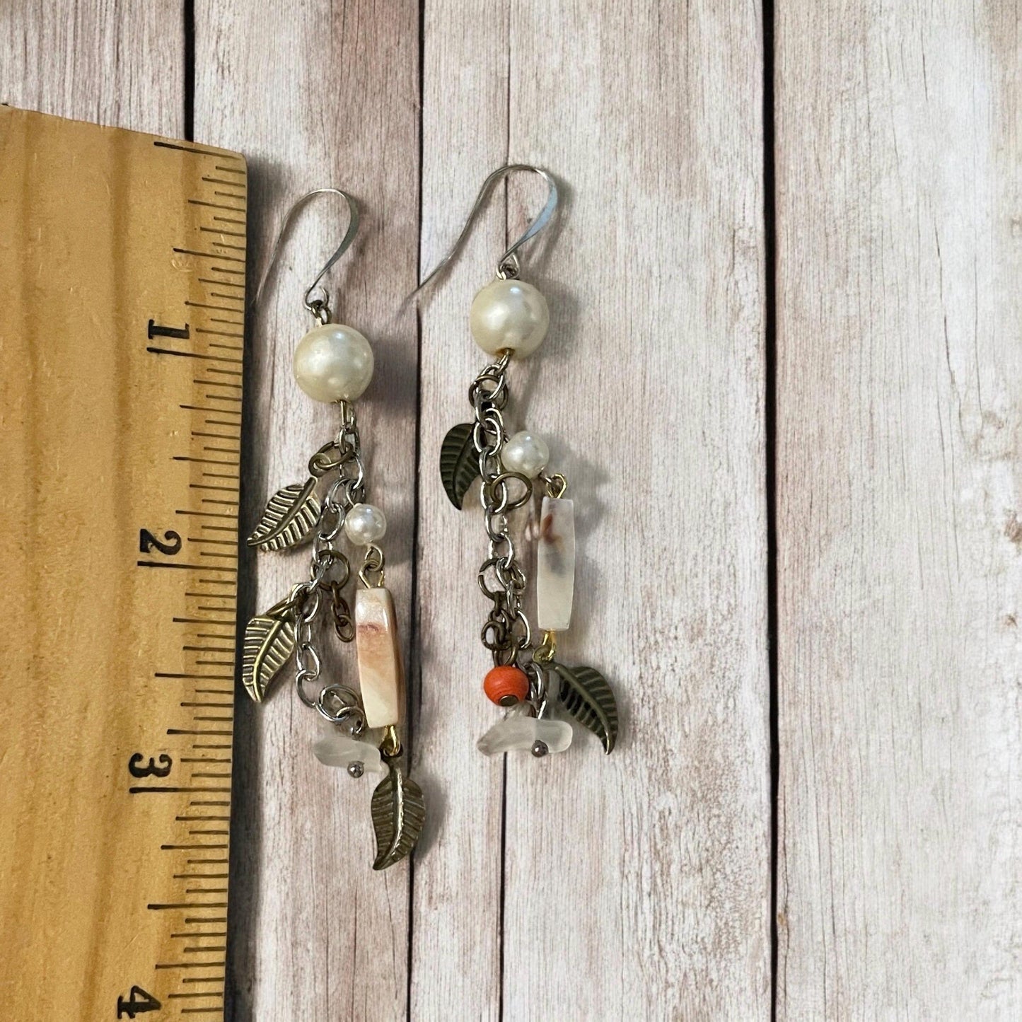 Collage inspired earrings - mixed materials including vintage metal leaves, orange wood, chain, faux pearls and ivory faux bone spacers