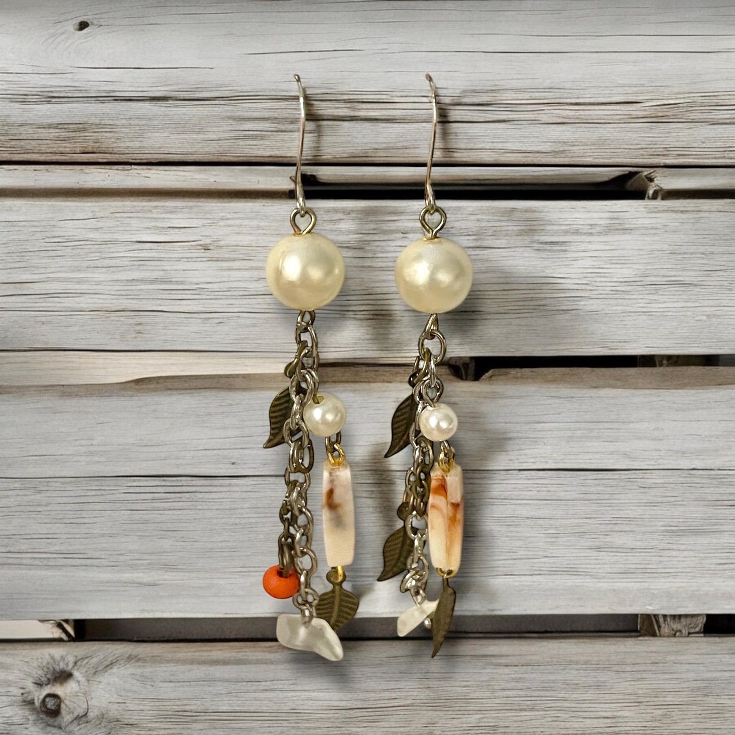 Collage inspired earrings - mixed materials including vintage metal leaves, orange wood, chain, faux pearls and ivory faux bone spacers