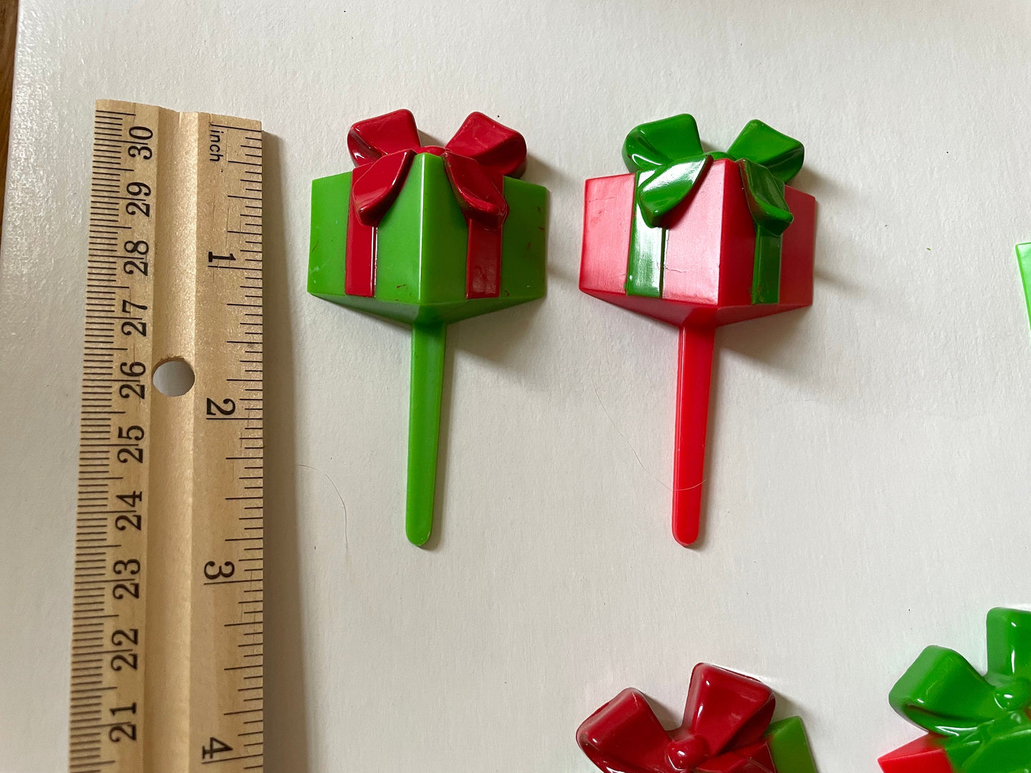 One dozen christmas cupcake toppers - Mix of red and green 3D plastic cake toppers - little wrapped packages with bows