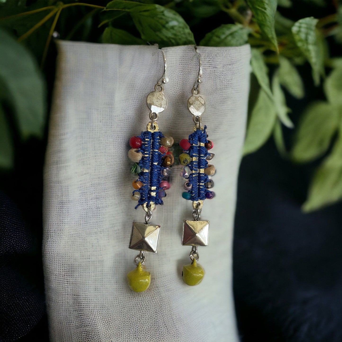 Mixed material collage earrings - metal, string, glass, and mustard yellow tiny bells