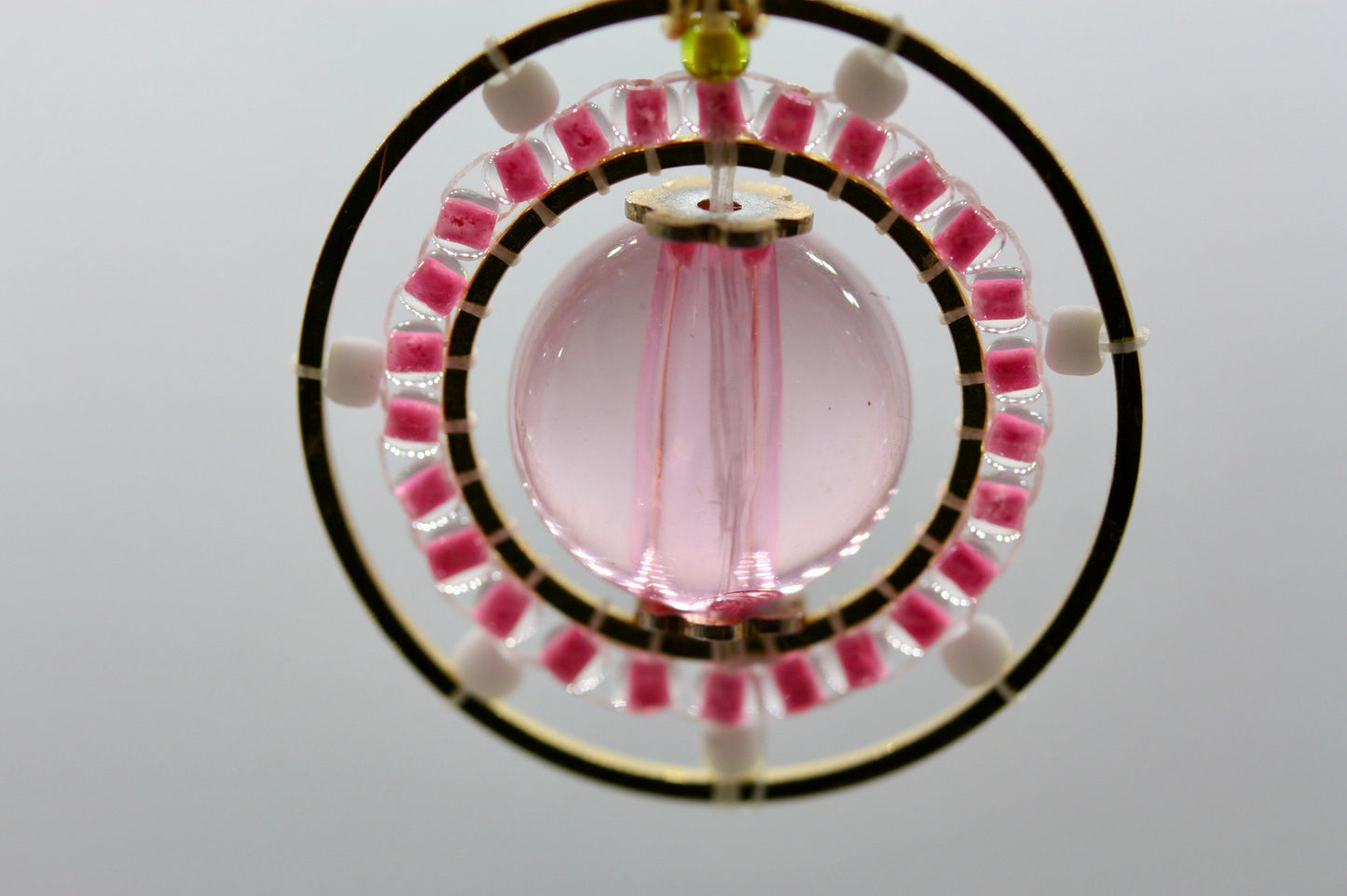 Pink and white intricate beadwork small circular dangle earrings