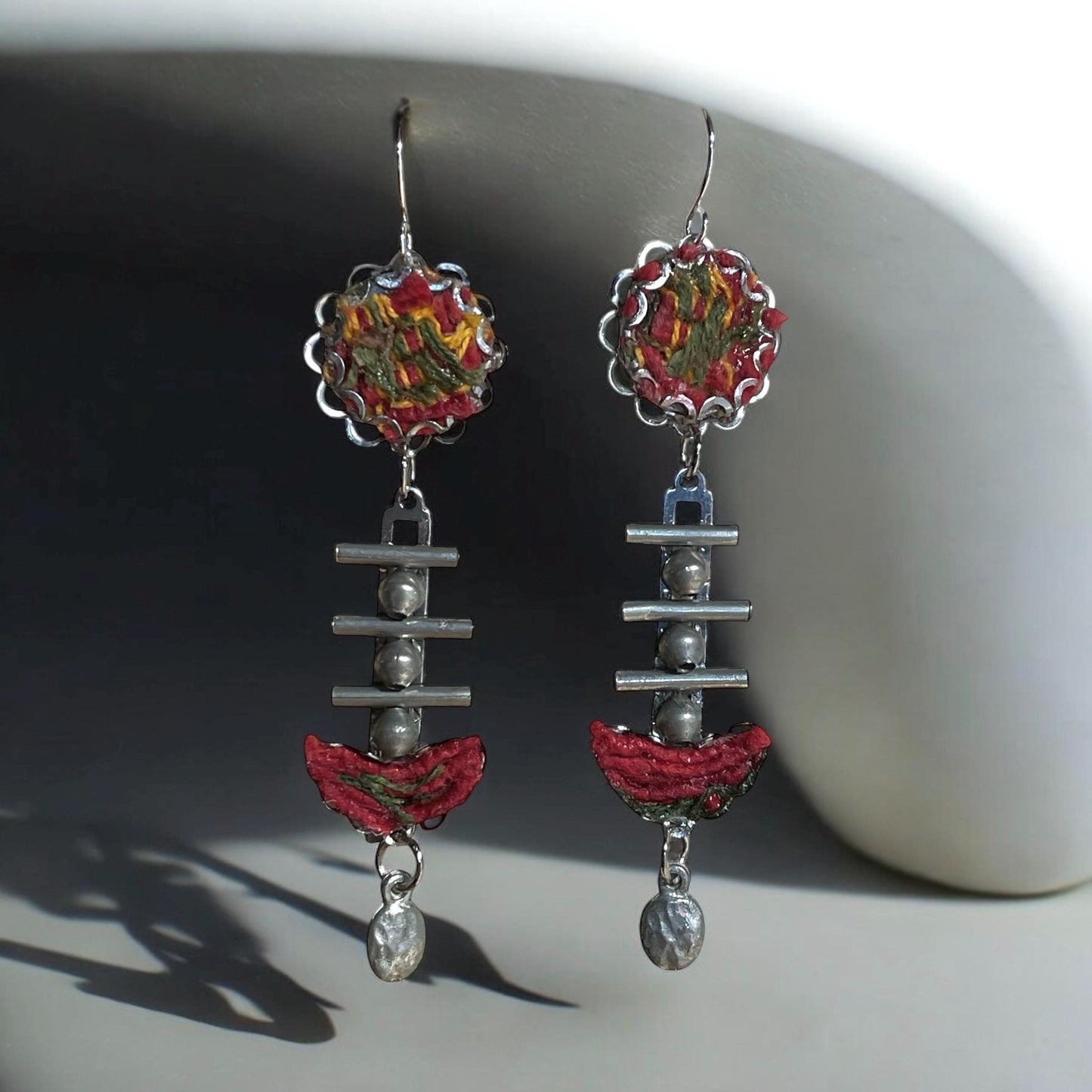 Red, yellow and olive green mixed media collage earrings with fabric, thread, mixed metals and hammered drops; Sterling silver ear wires