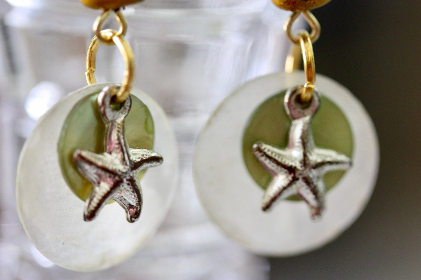 Mixed materials - green mother of pearl, metal starfish and yellow wood - beach themed dangle earrings