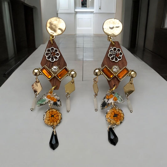 Mixed media earrings made with embroidery from a vintage linen table runner,  rosary wood, hammered metal, glass tubes, orange rhinestones