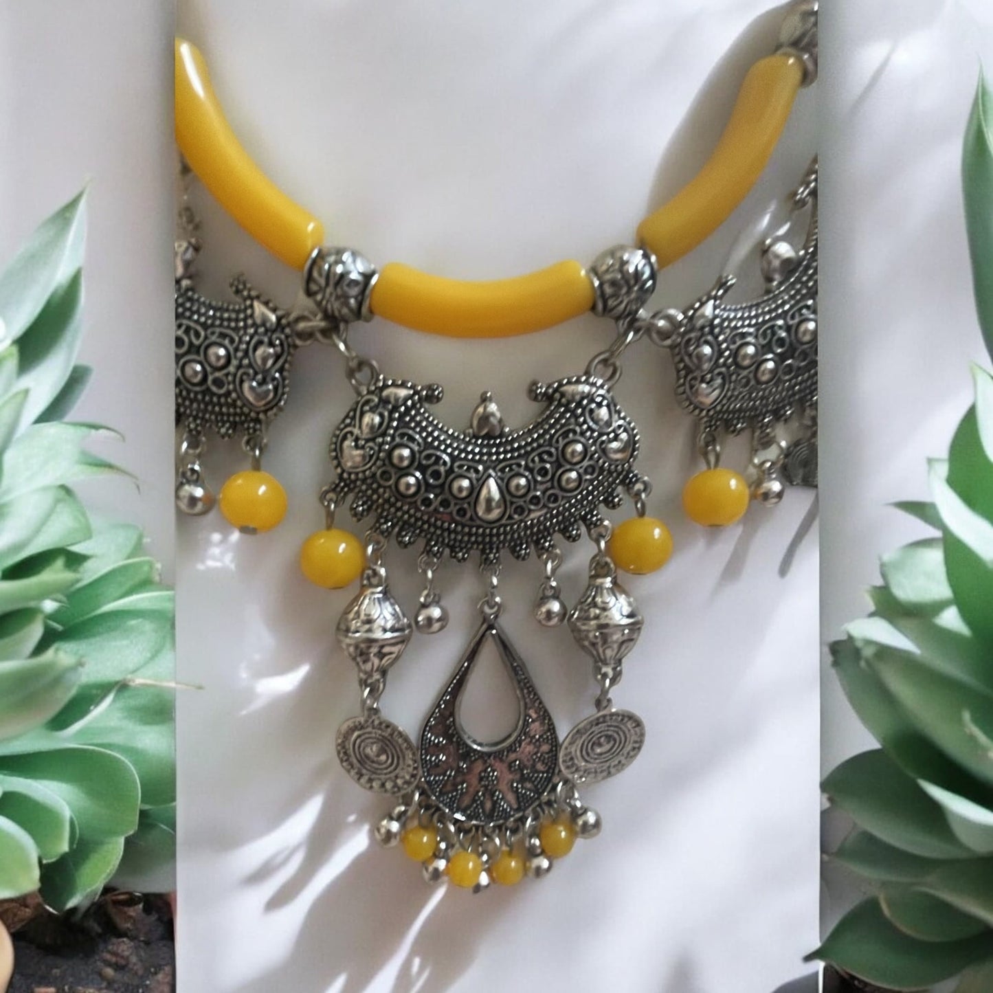 Exotic Indian style necklace with yellow beaded balls/tubes and ornate silver trim