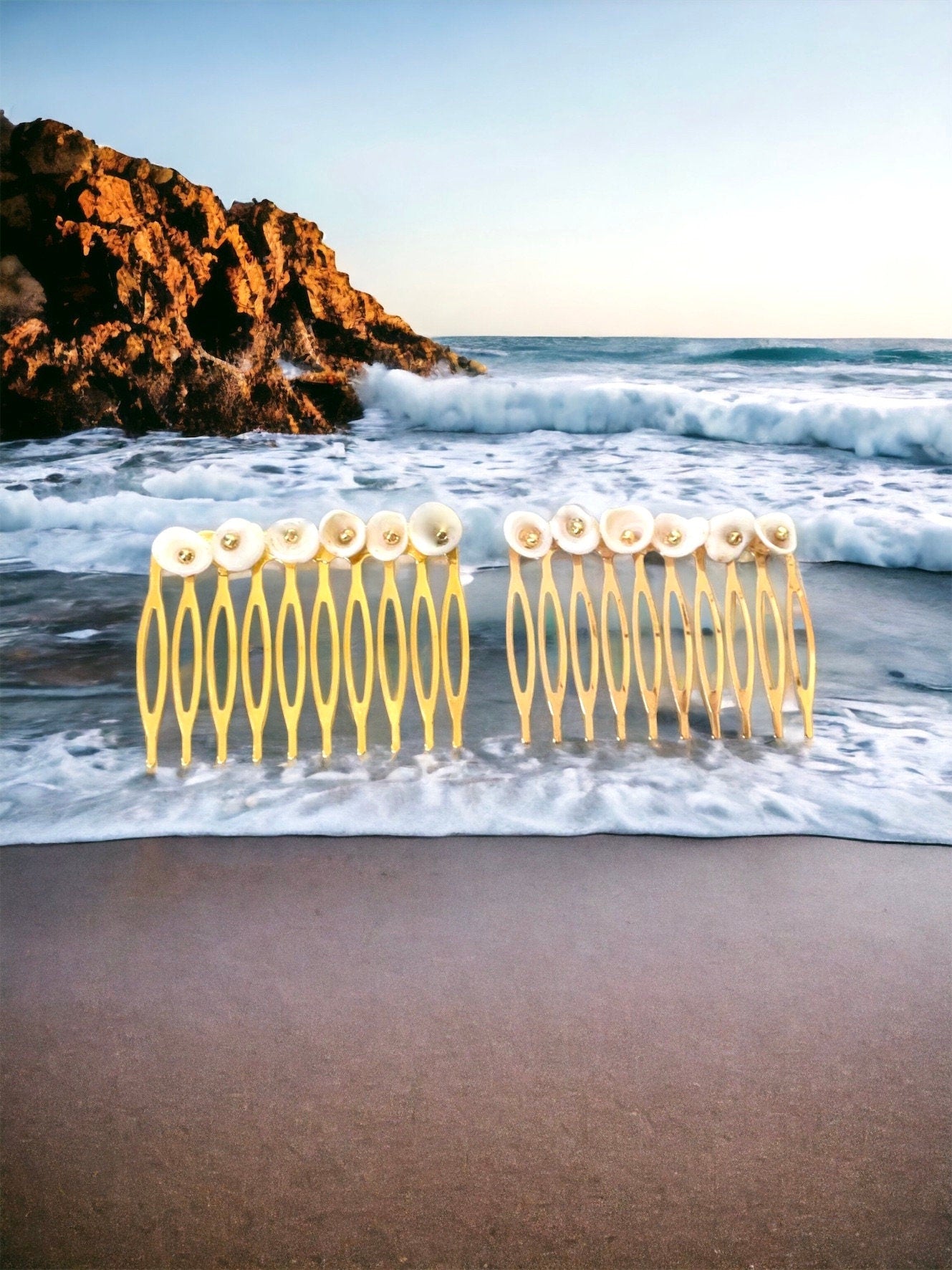 Pair of ivory white shell hair combs with goldtone centers