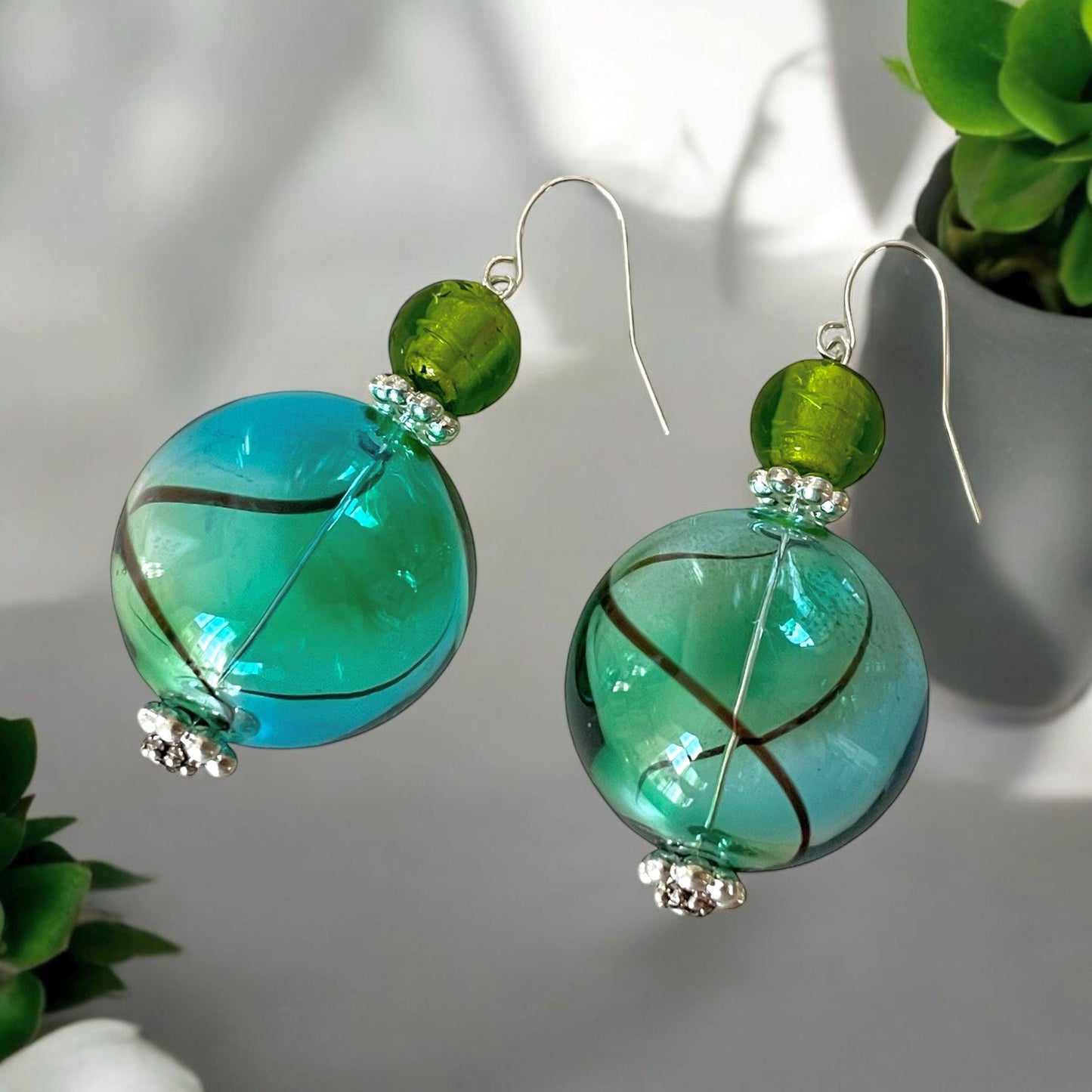Shades of green and blue blown glass dangle earrings