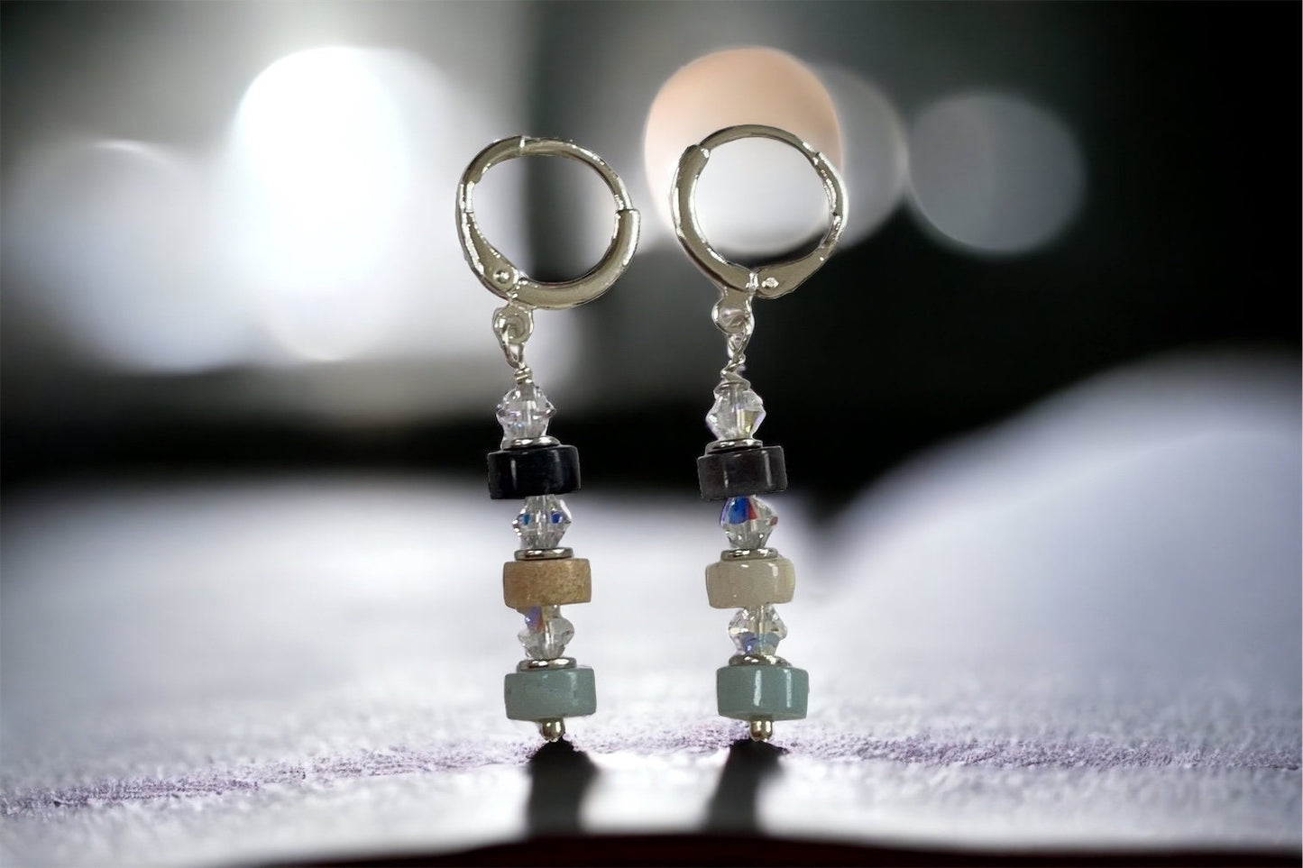 Handmade dangle earrings - turquoise, cream and black stone interspersed with Swarovski crystals - huggie ear wires