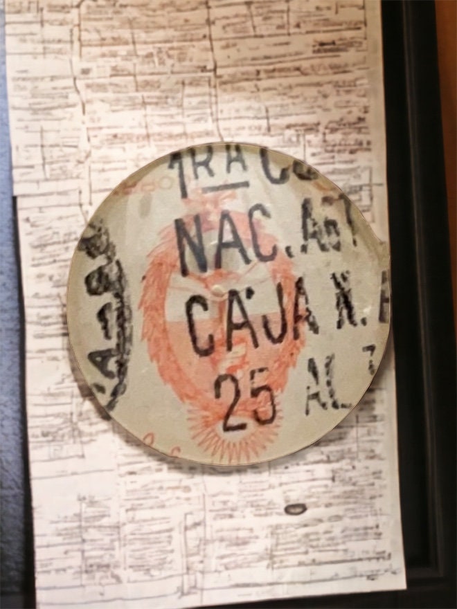Pendant or pin made from a genuine vintage postage stamp from Argentina