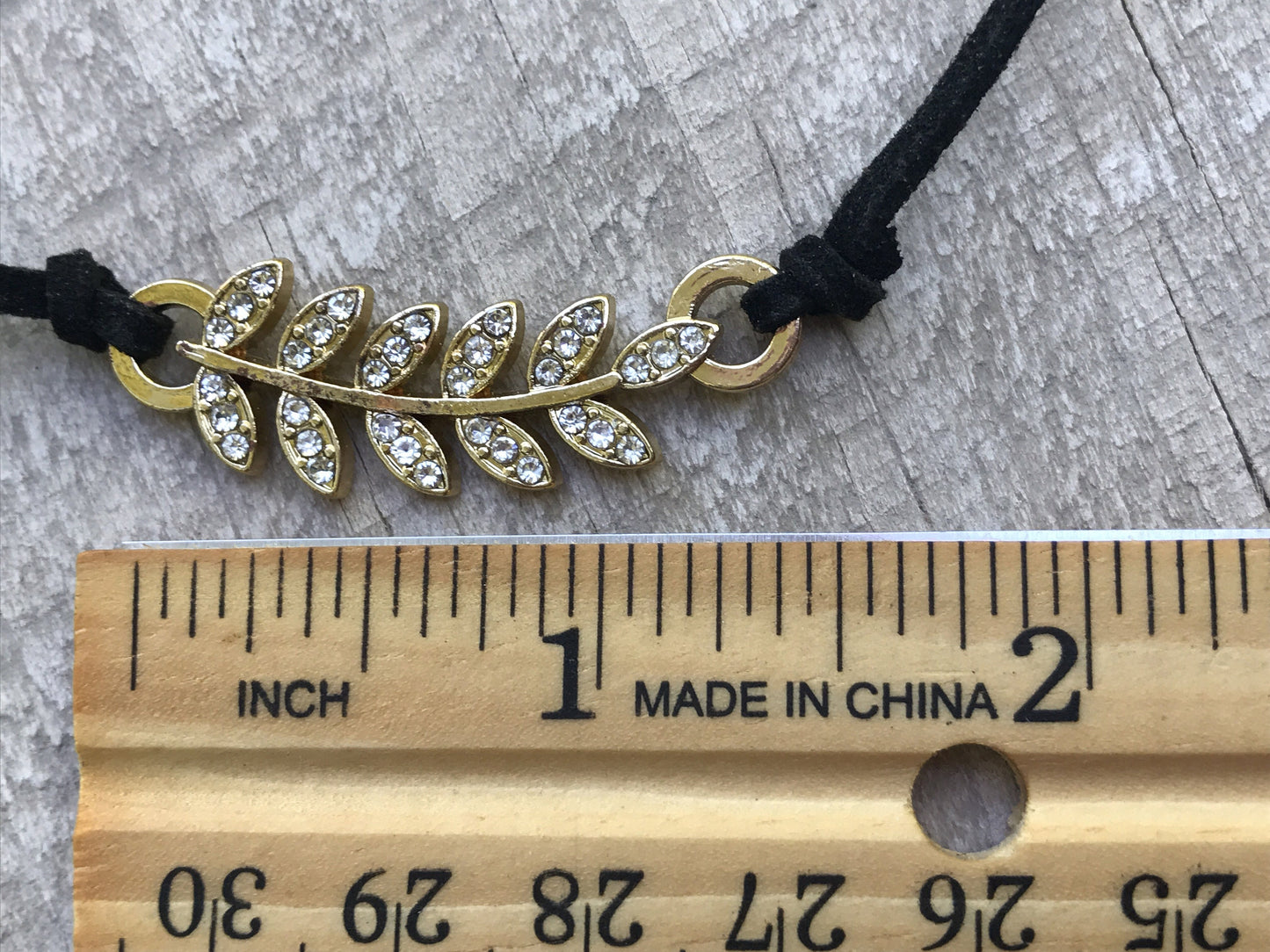 Vintage Rhinestone feather on black vintage necklace