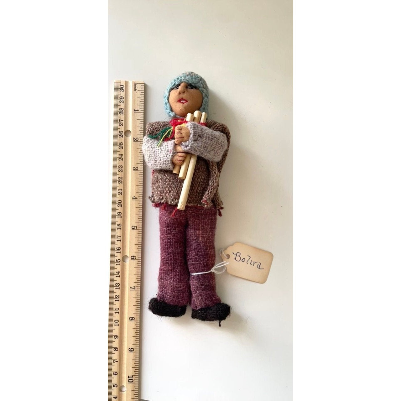 Vintage Bolivian man playing panpipes - collectible folk art doll with handmade woven wool clothing