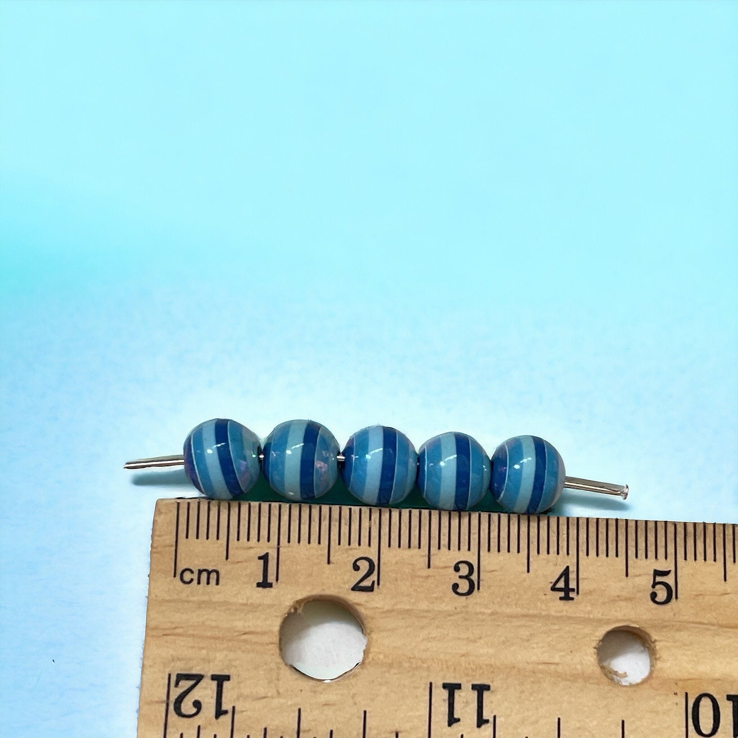 One dozen striped shades of blue vintage beads - approx. 6 mm each