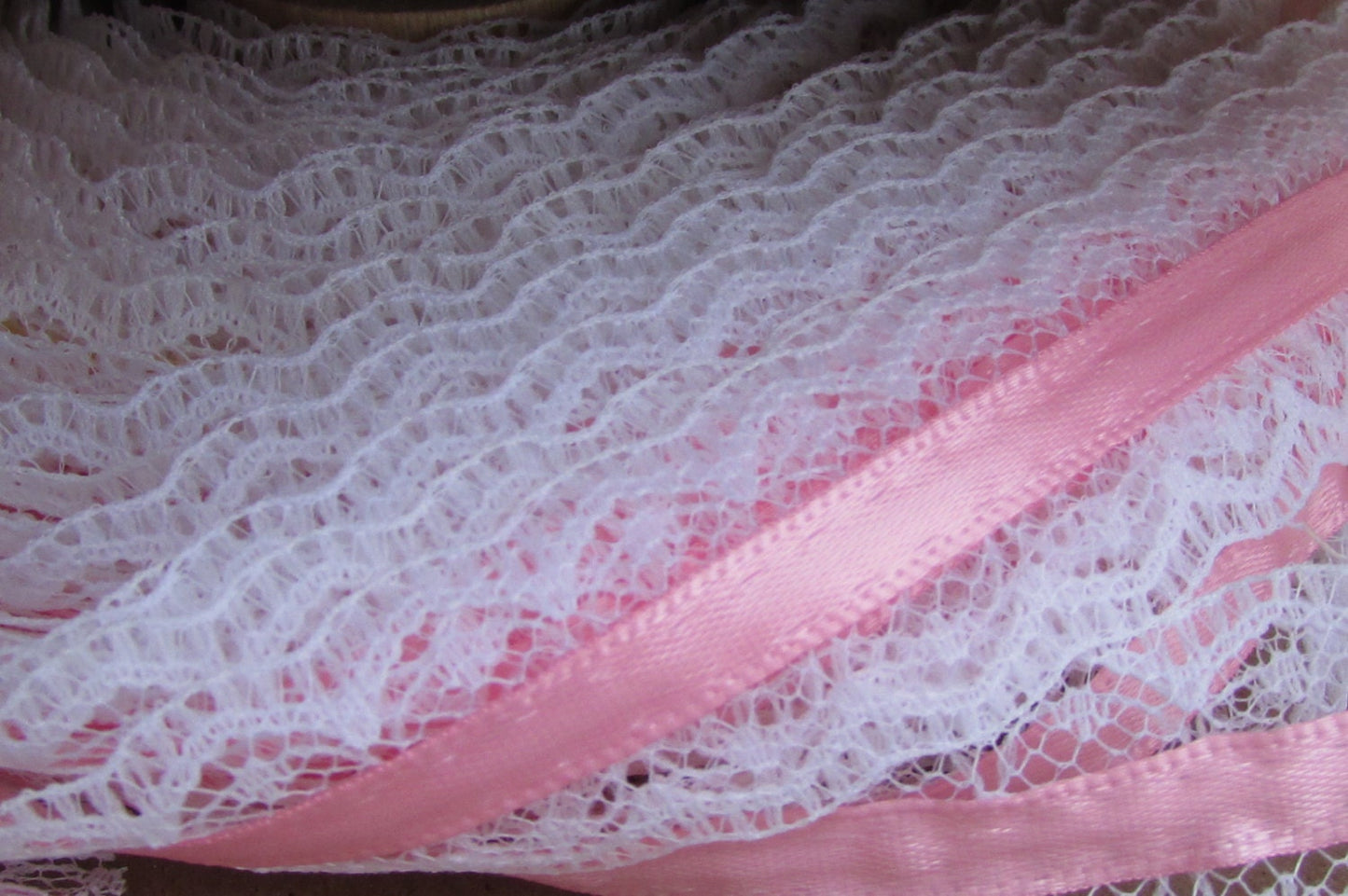 Victorian-style vintage narrow white lace with pink ribbon in the center - by the yard