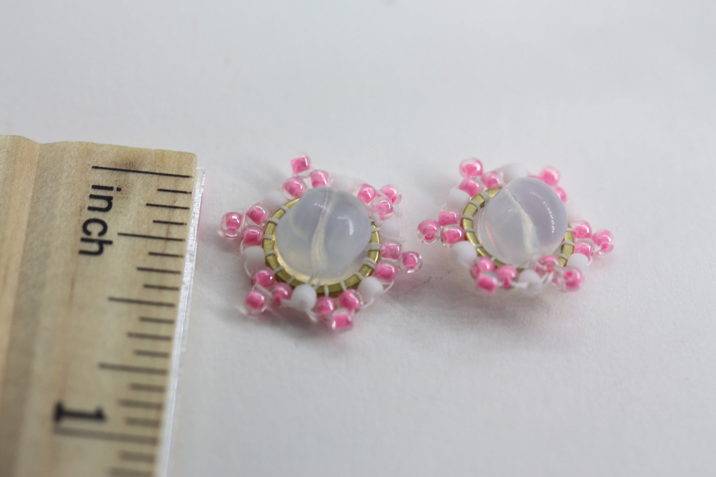 Hand beaded stud earrings - pink and white beadwork around transluscent opalescent glass bead
