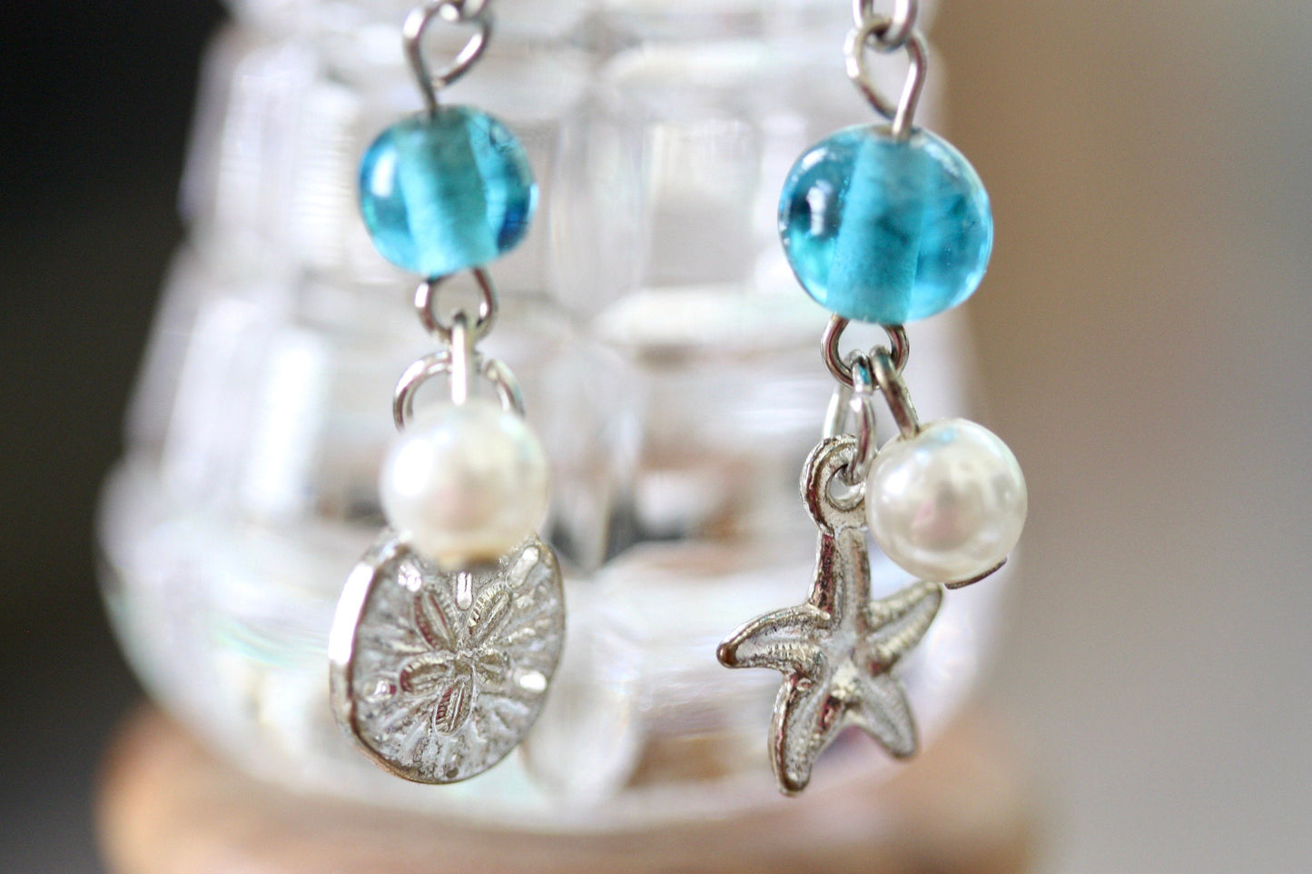 Faux pearl, clear crystal and recovered blue vintage glass dangle earrings with starfish and silver dollar metal shell