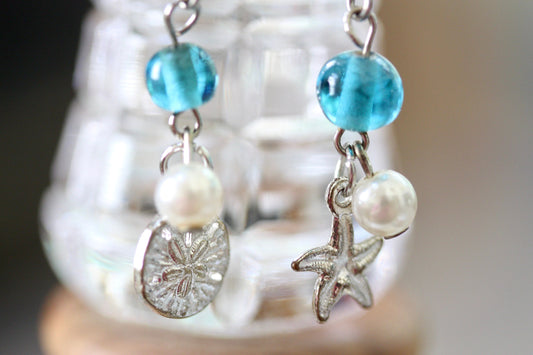 Faux pearl, clear crystal and recovered blue vintage glass dangle earrings with starfish and silver dollar metal shell