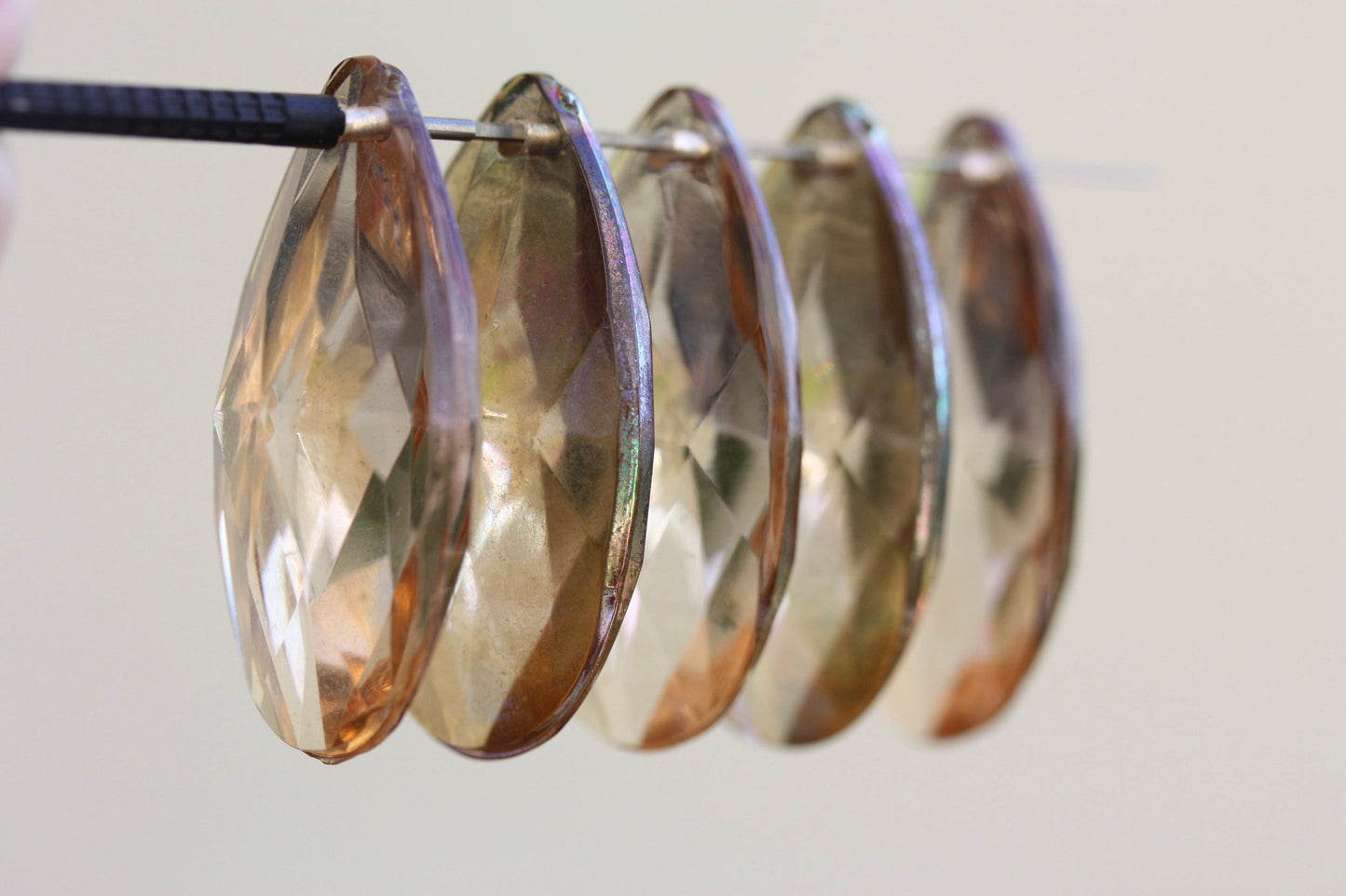 Large light gold glass golden teardrop crystals from a vintage chandelier