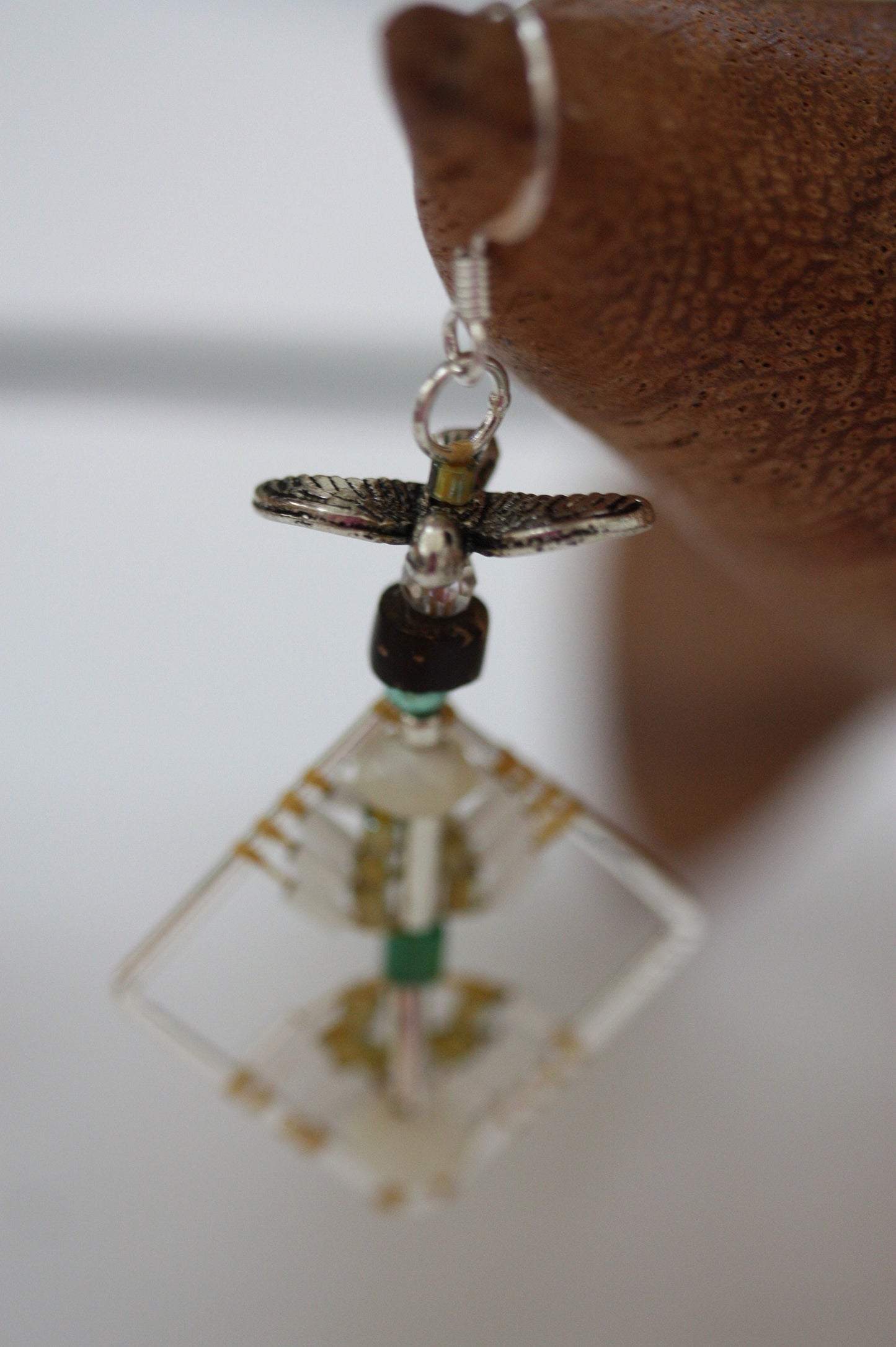 Birds taking flight - intricate beadwork seed bead dangle earrings on diamond-shaped base with flying bird embellishments