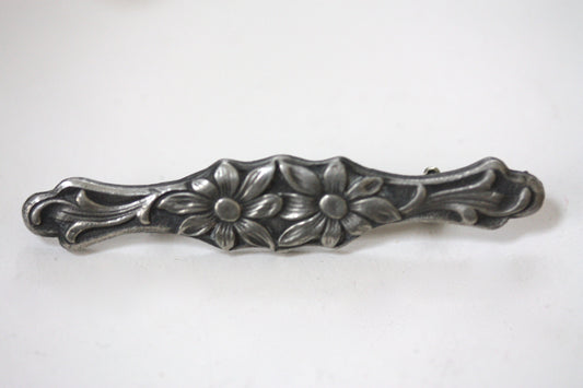 Intricately carved floral vintage bar pin