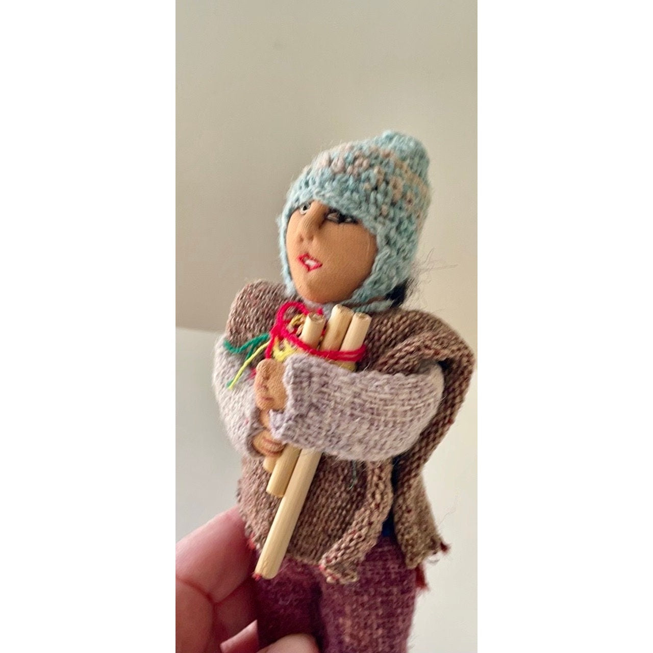 Vintage Bolivian man playing panpipes - collectible folk art doll with handmade woven wool clothing