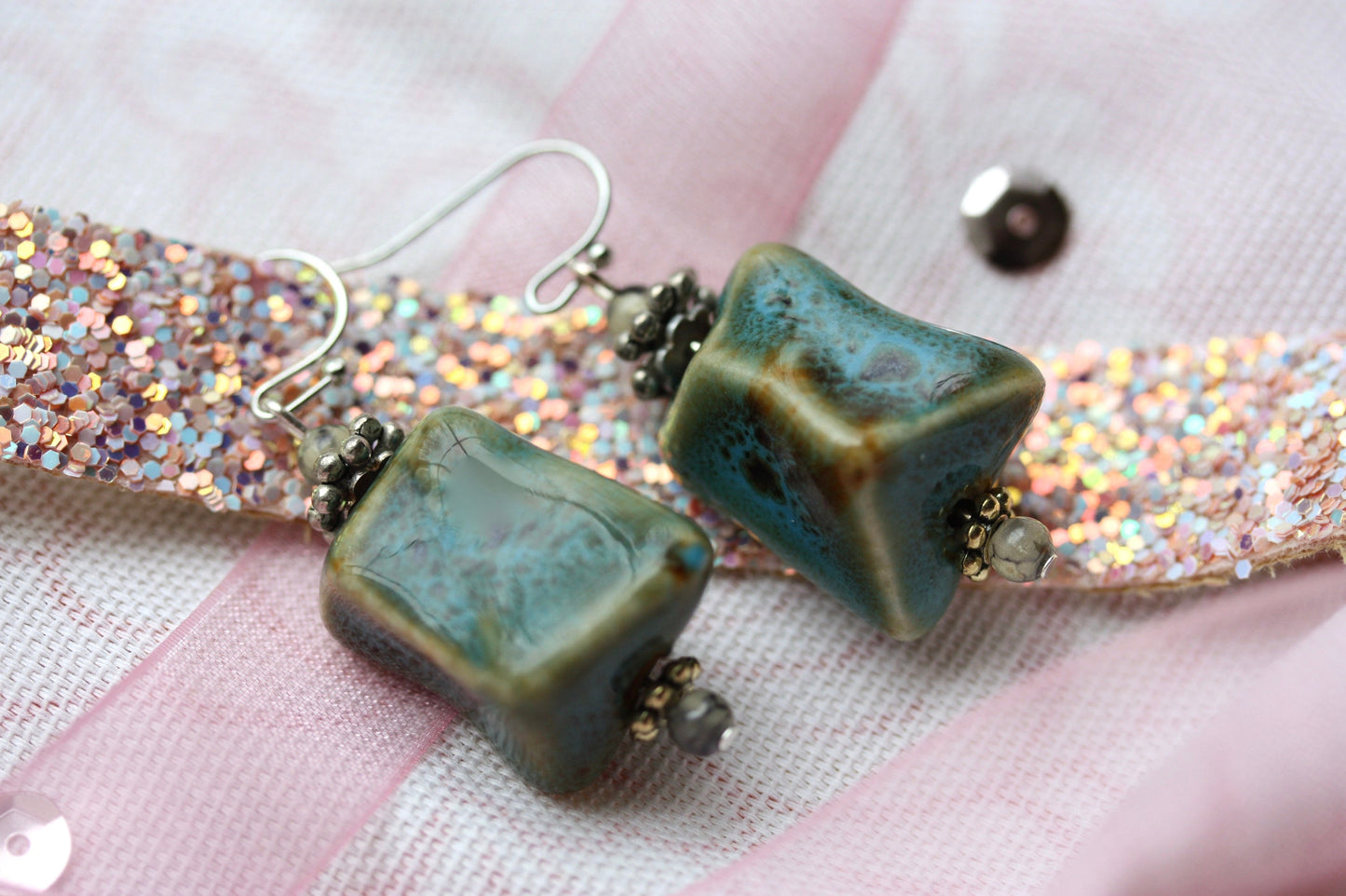 Handmade dangle earrings made with uniquely shaped faux turquoise beads