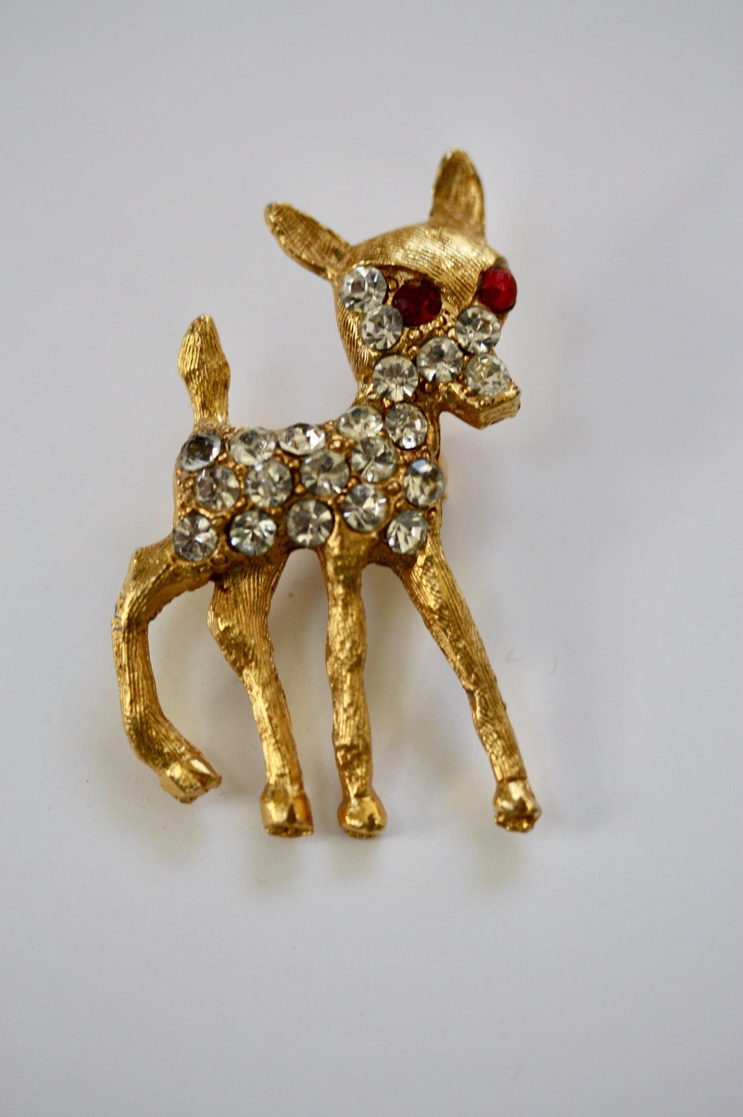 Charming vintage reindeer pin loaded with rhinestones