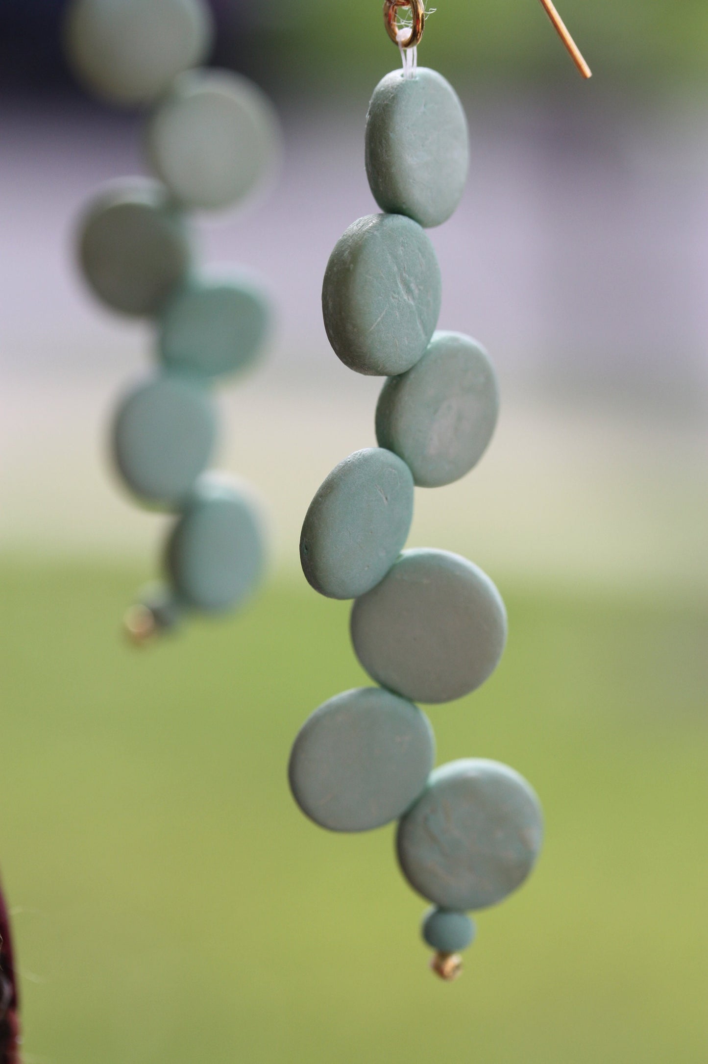 Handsewn aqua tinted wooden disk Scandinavian-inspired earrings - with sloped goldstone ear wires