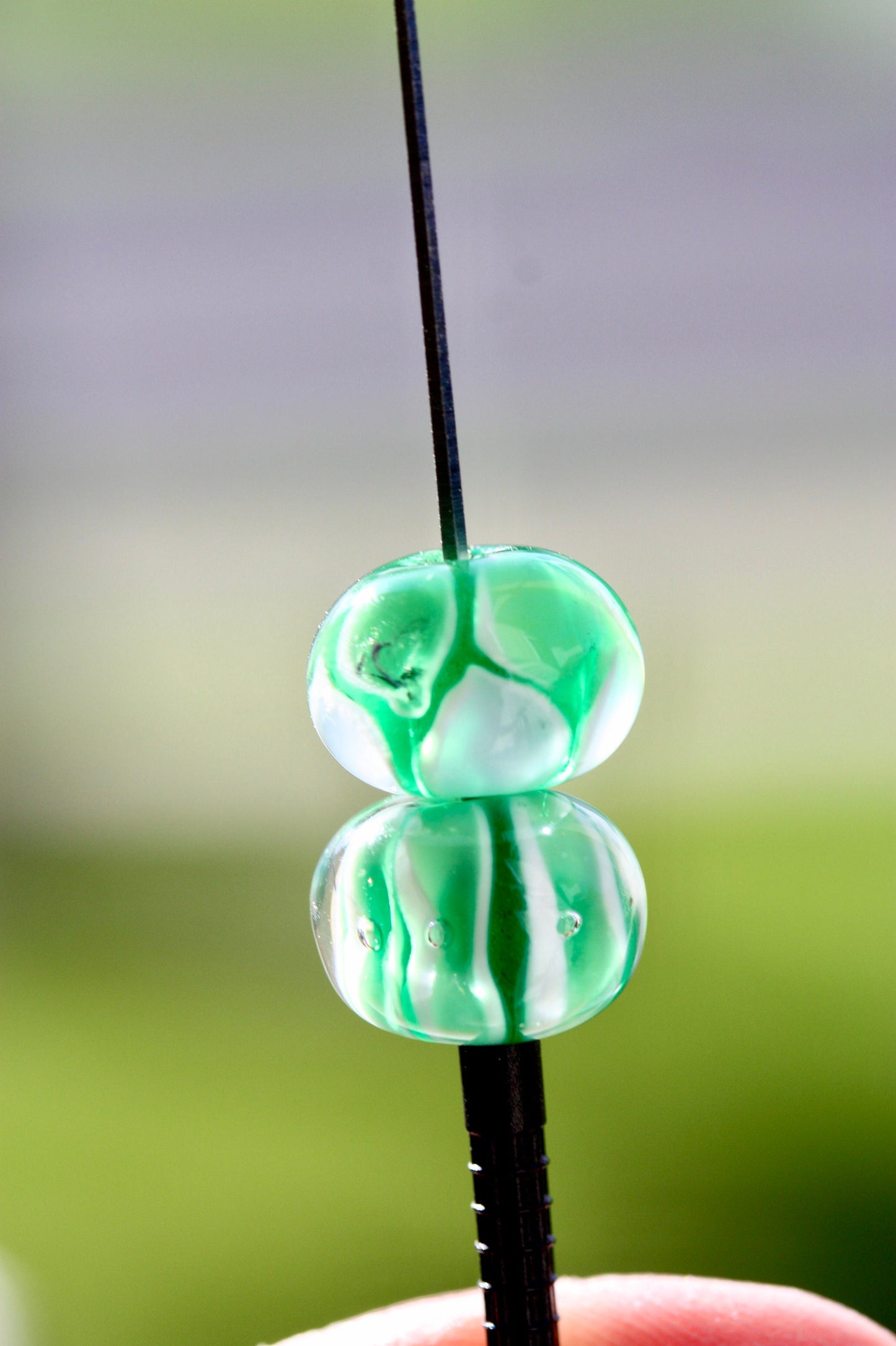 Two stunning vintage glass beads - shades of green and white