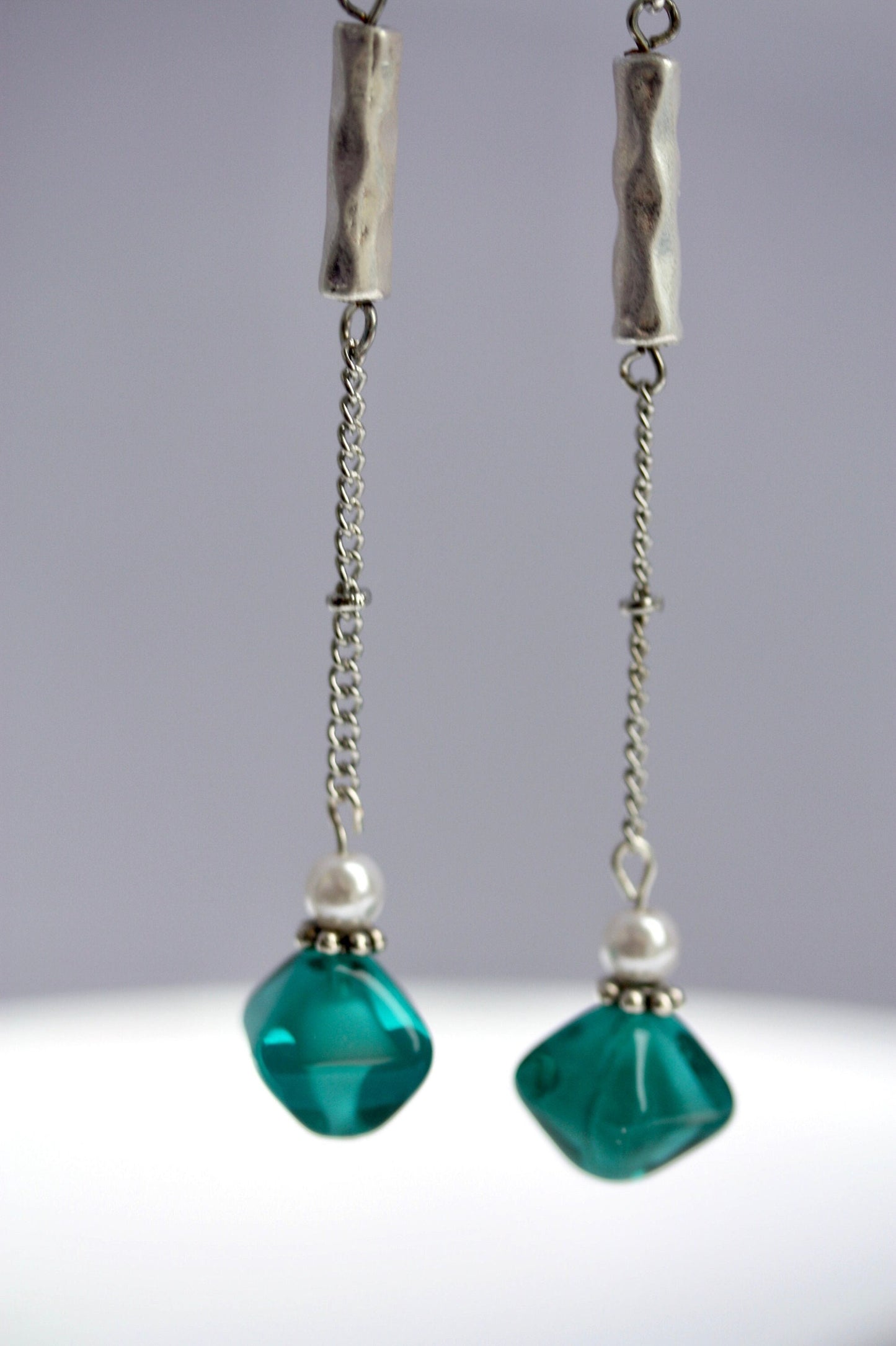 Long mixed material silver chain earrings with silver bars, faux baby pearls and triangular turquoise glass