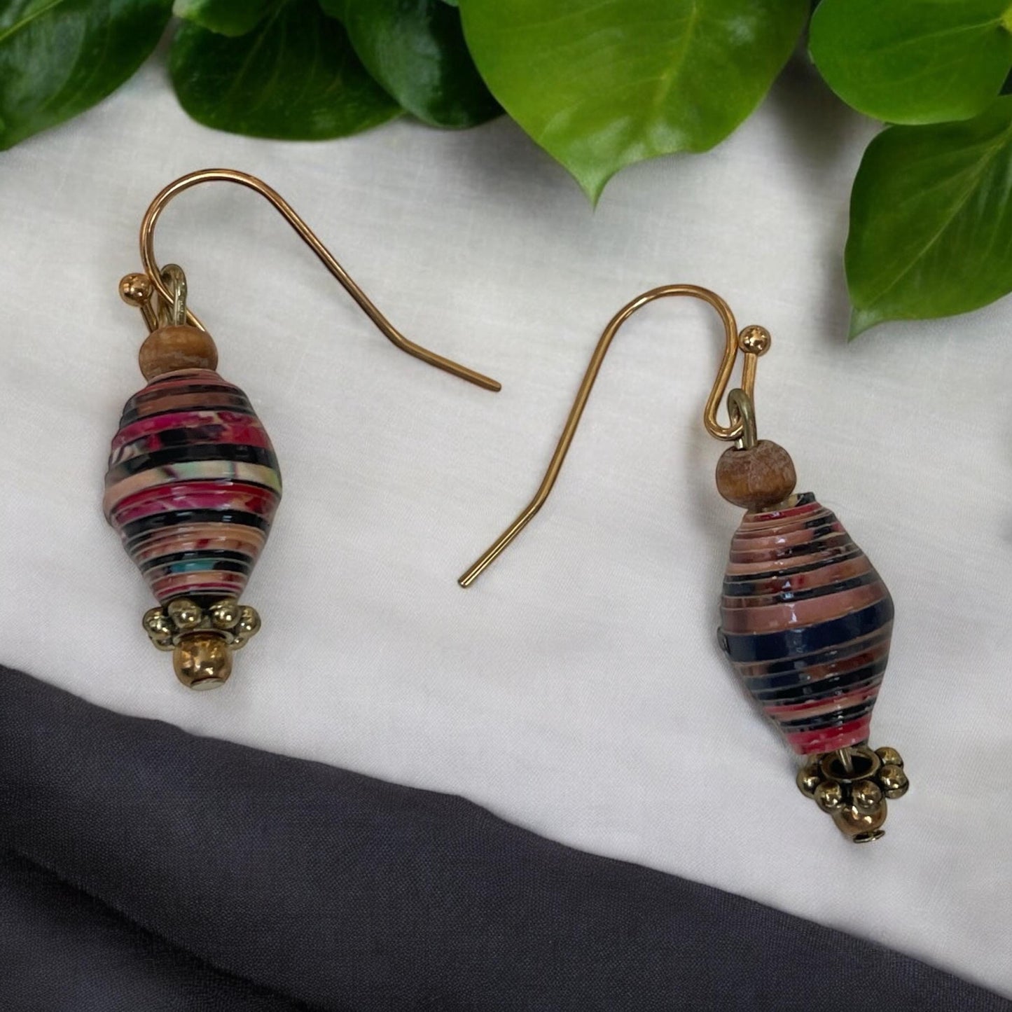 Little dangle earrings made with vintage rolled paper beads in shades of deep red, brown and cream