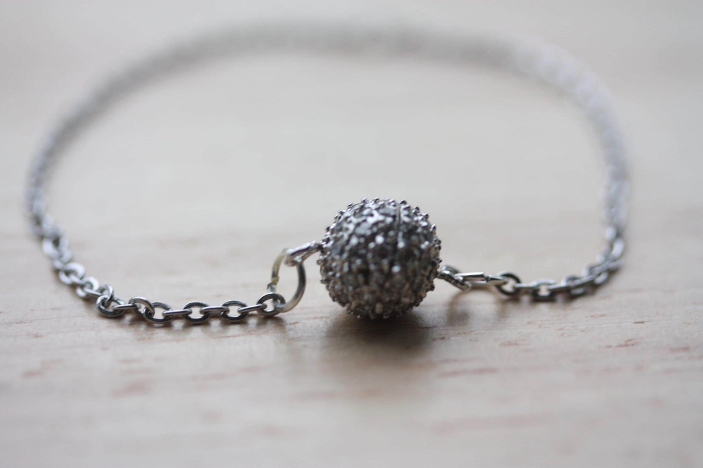 Handmade bracelet made with unique round marcasite ball that is the focal point and also unwinds as the clasp