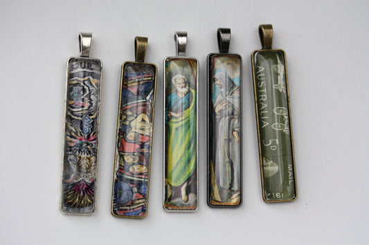 Necklace pendants made from genuine vintage and antique postage stamps from around the world - saints, Australian plane, Wicca  sun and moon