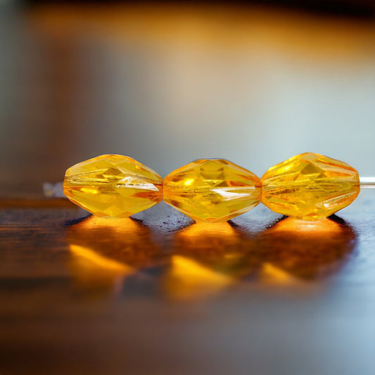 Orange oval faceted vintage beads - approx. 15 mm