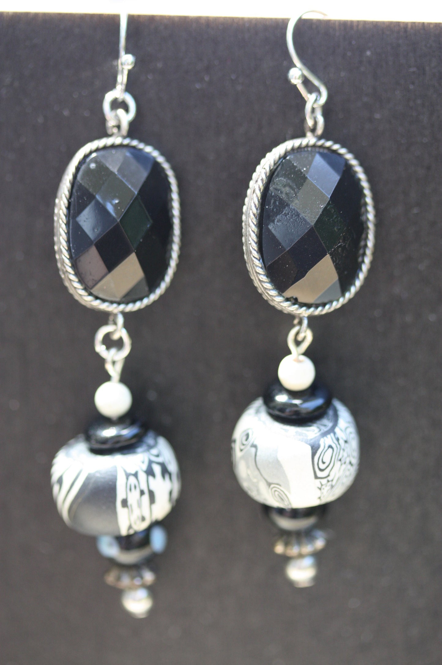 Black and white mixed media earrings made of upcycled polymer clay, combined with vintage black faux crystal, metal and glass spacer beads
