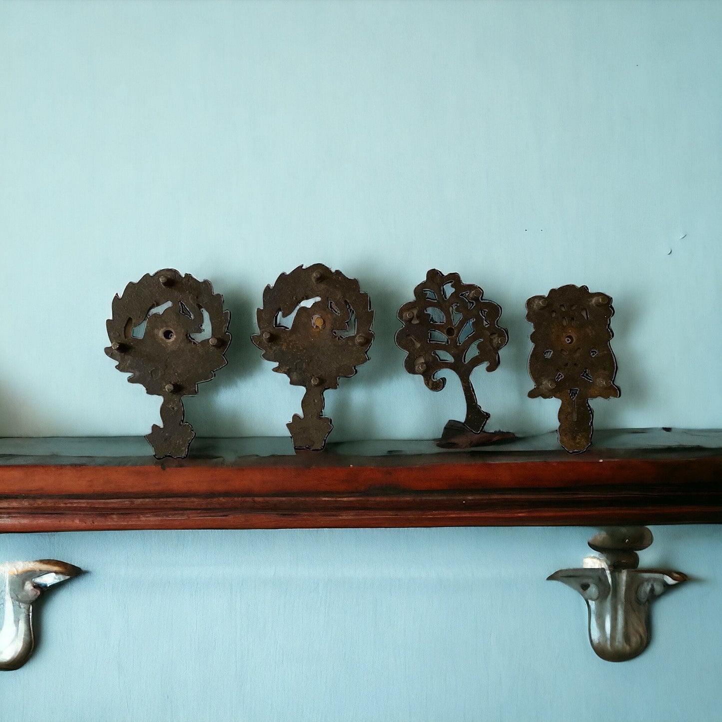 Set of 4 small cast iron trivets - vintage or antique?