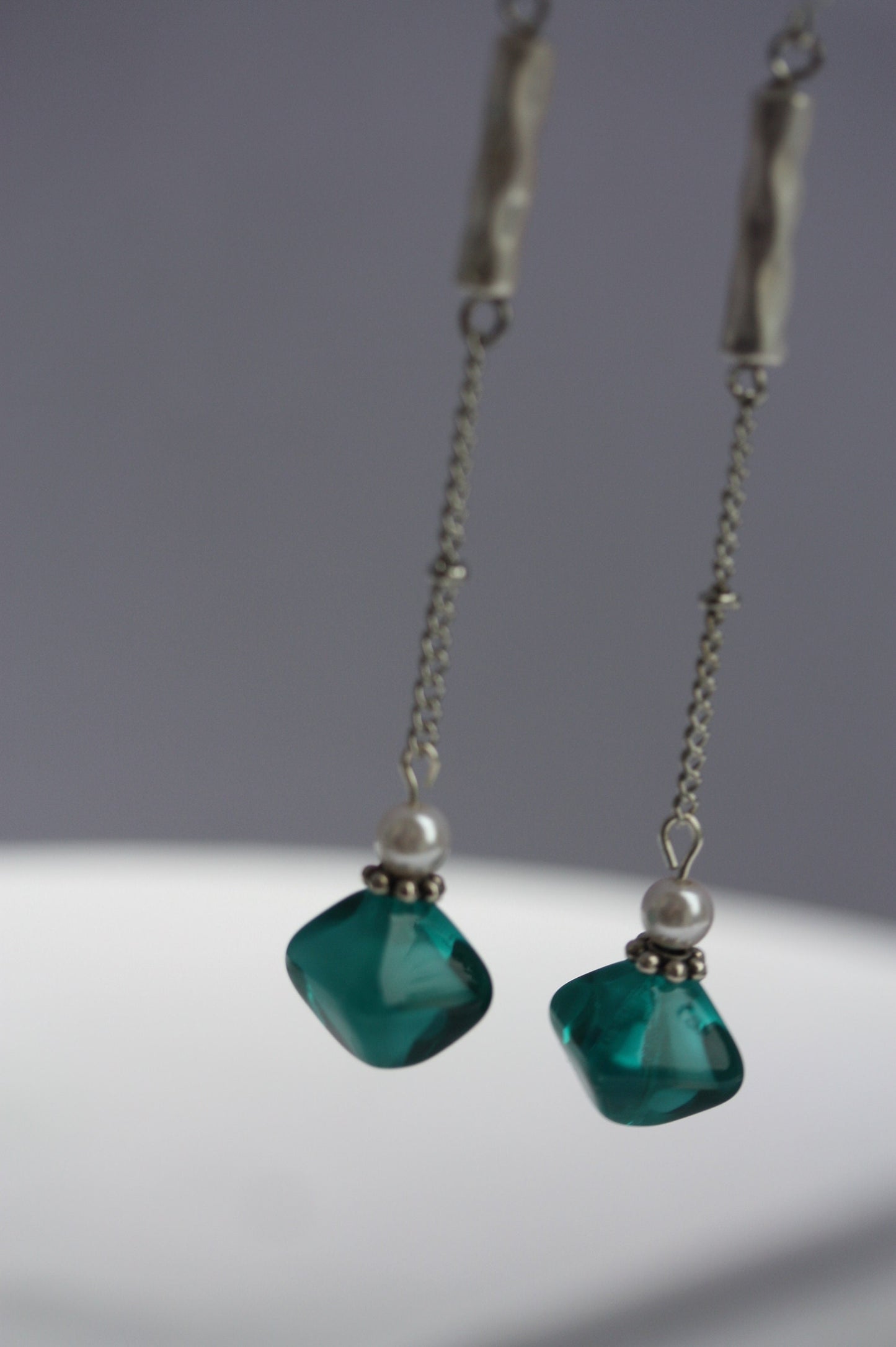 Long mixed material silver chain earrings with silver bars, faux baby pearls and triangular turquoise glass