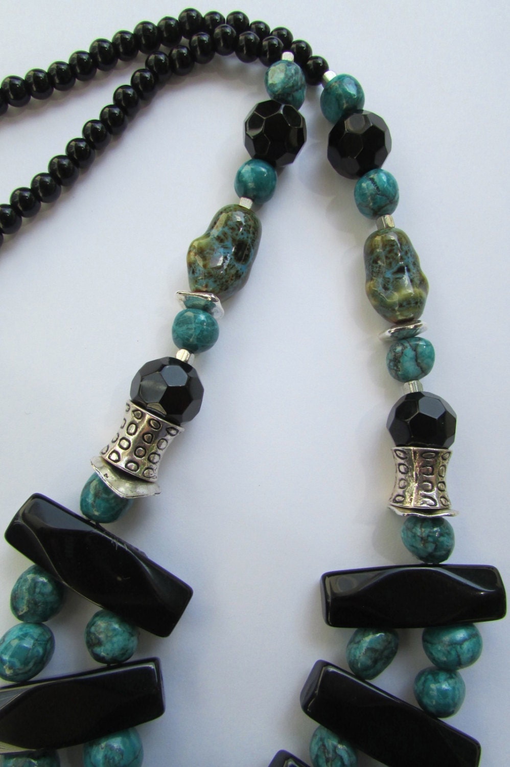 Mixed material beaded necklace - porcelain, metal, plastic, glass - shades of turquoise & black