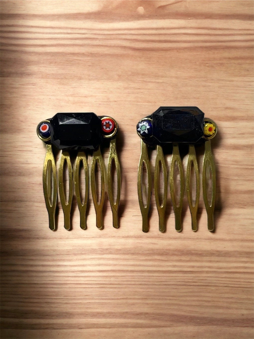 Pair of one-of-a-kind handmade Italian glass micro mosaic hair combs with millefiori around vintage black bezel