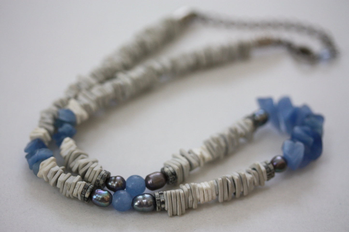 Unique vintage necklace with white shell heishi beads with blue semi precious stone chips
