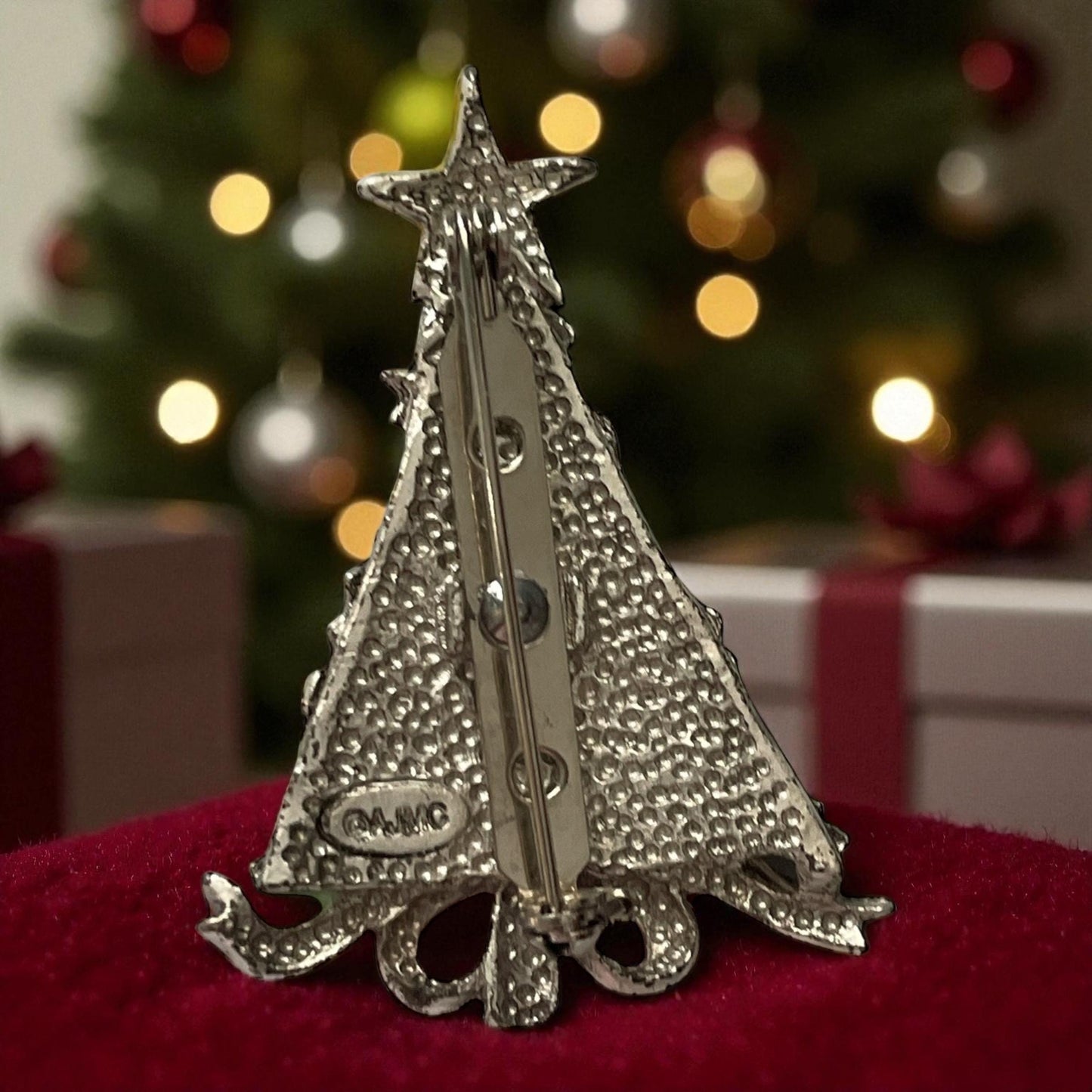 AJMC Christmas Tree Pin • Vintage Enamel Holiday Brooch with Red Rhinestones & Star Topper