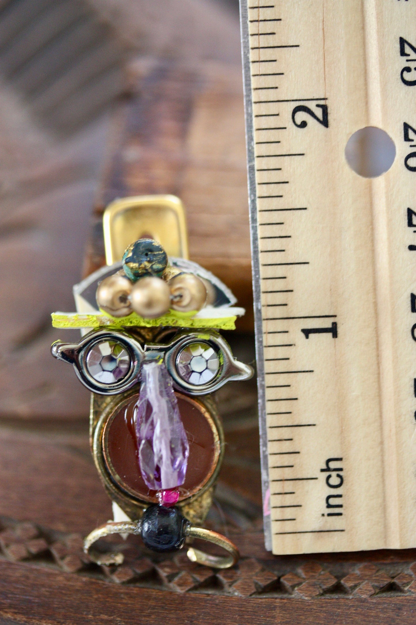Meet "Henrietta."  Henrietta is a really cool assemblage art gal who can be transformed into a necklace, pin, magnet, bottle or little dish