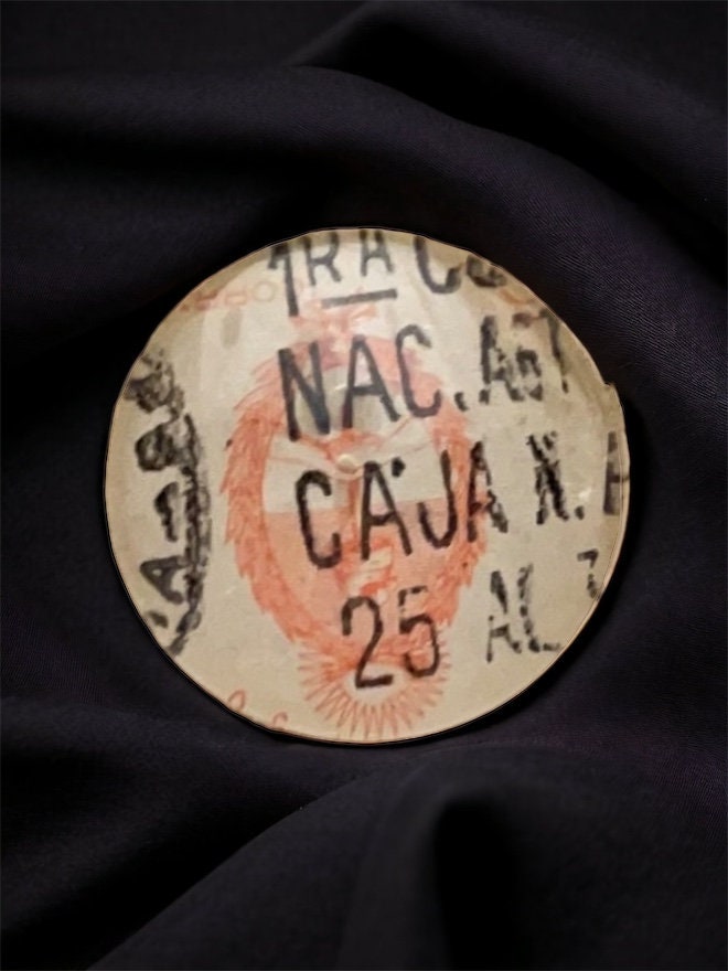 Pendant or pin made from a genuine vintage postage stamp from Argentina