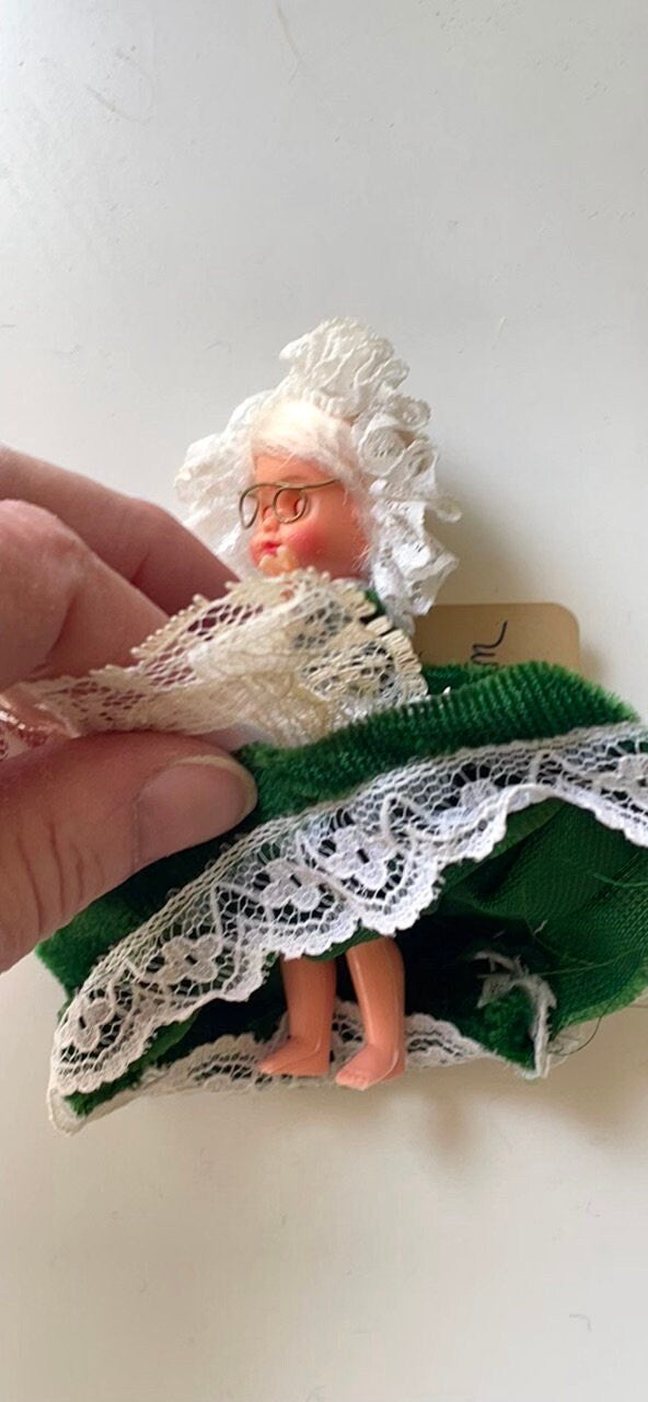 Stunning vintage collectible art baby Doll from Belgium with green velvet dress and lace overlay