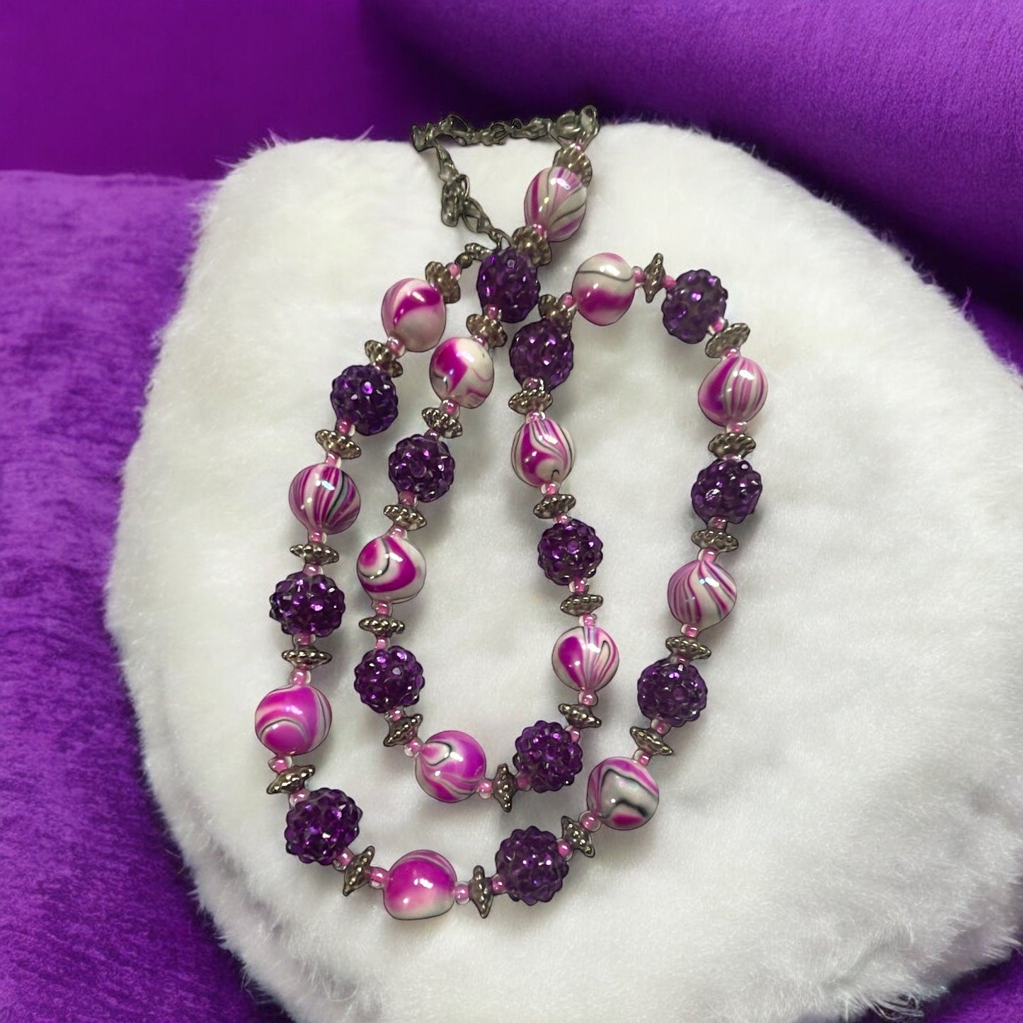 Shades of pinkish purple swirled vintage necklace with purple rhinestone beaded balls