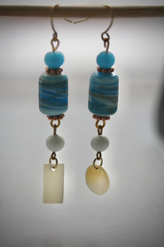 Long dangle earrings made of both new and vintage components -blue and gold art glass, mother of pearl dangles,vintage blue and white beads