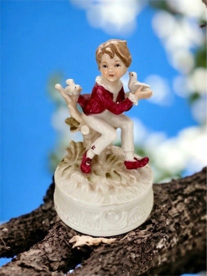 1977 Berman and Anderson stunning porcelain music box - boy dressed in red and white feeding birds