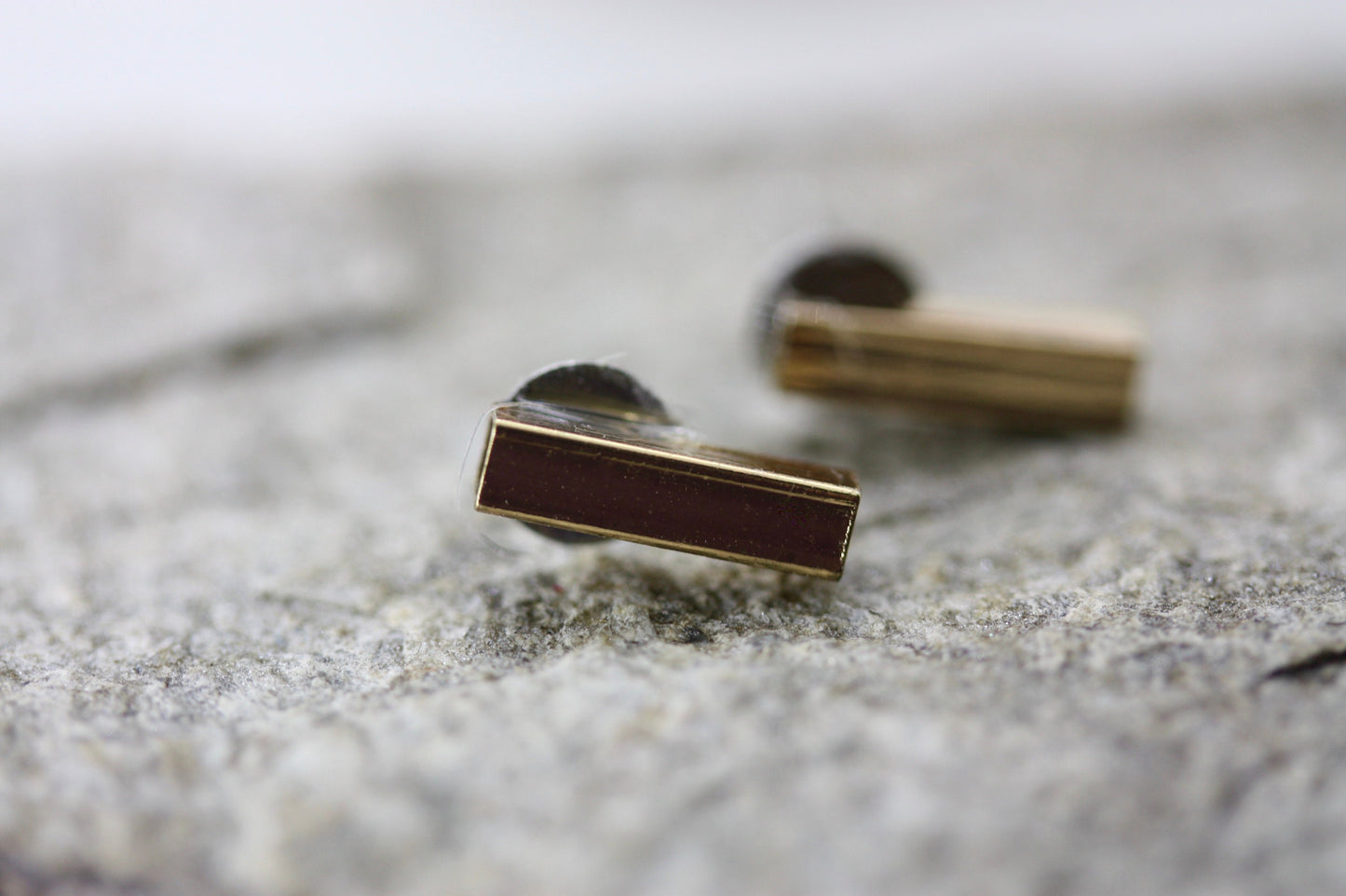 Tiny barely-there goldtone bar on silvertone circle minimalist stud earrings